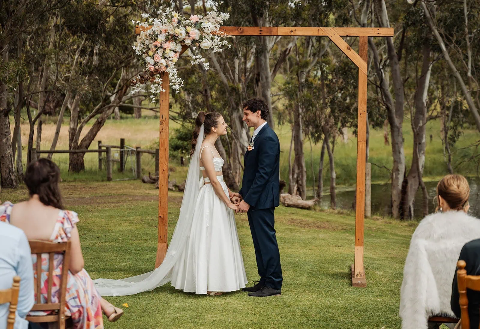 fleurieu cherries wedding - kimberley & richard 14 Elegant outdoor wedding with floral decorations and scenic views.