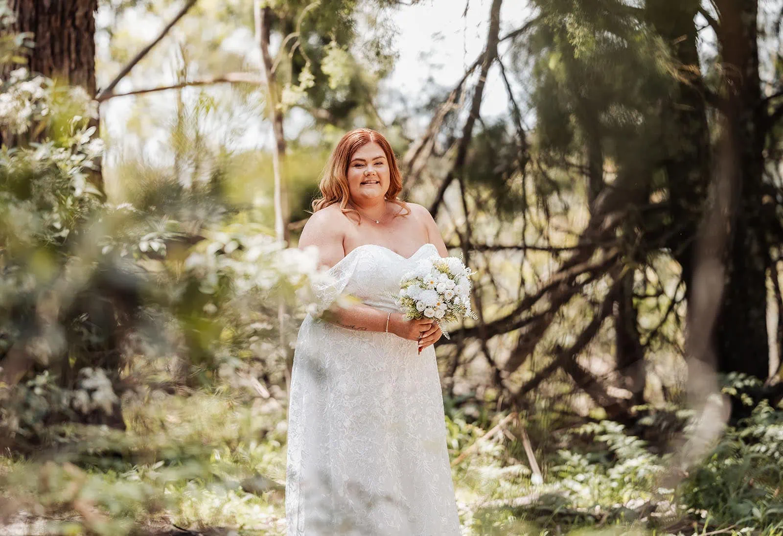 country victoria wedding in corrunnun – rachelle & anthony 311 Bride in a serene forest setting wearing an elegant wedding dress.