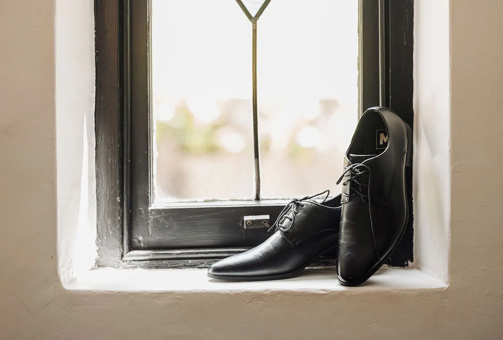 wedding at the manor in basket range - maryam & jason 111 Elegant black leather dress shoes for men’s formal wear.