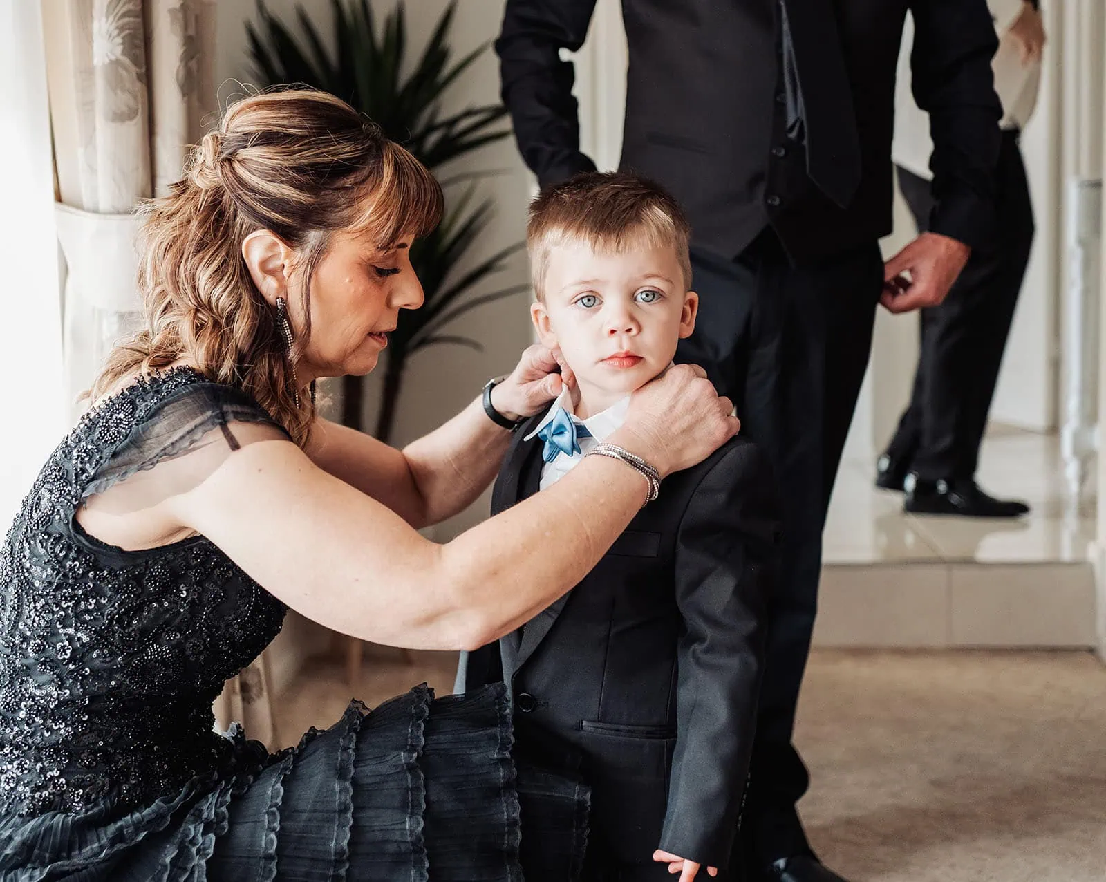silvestris of clarendon wedding - sam & wayne 188 Formal Preparation with Tender Moment: Elegant Attire and Emotion Captured.