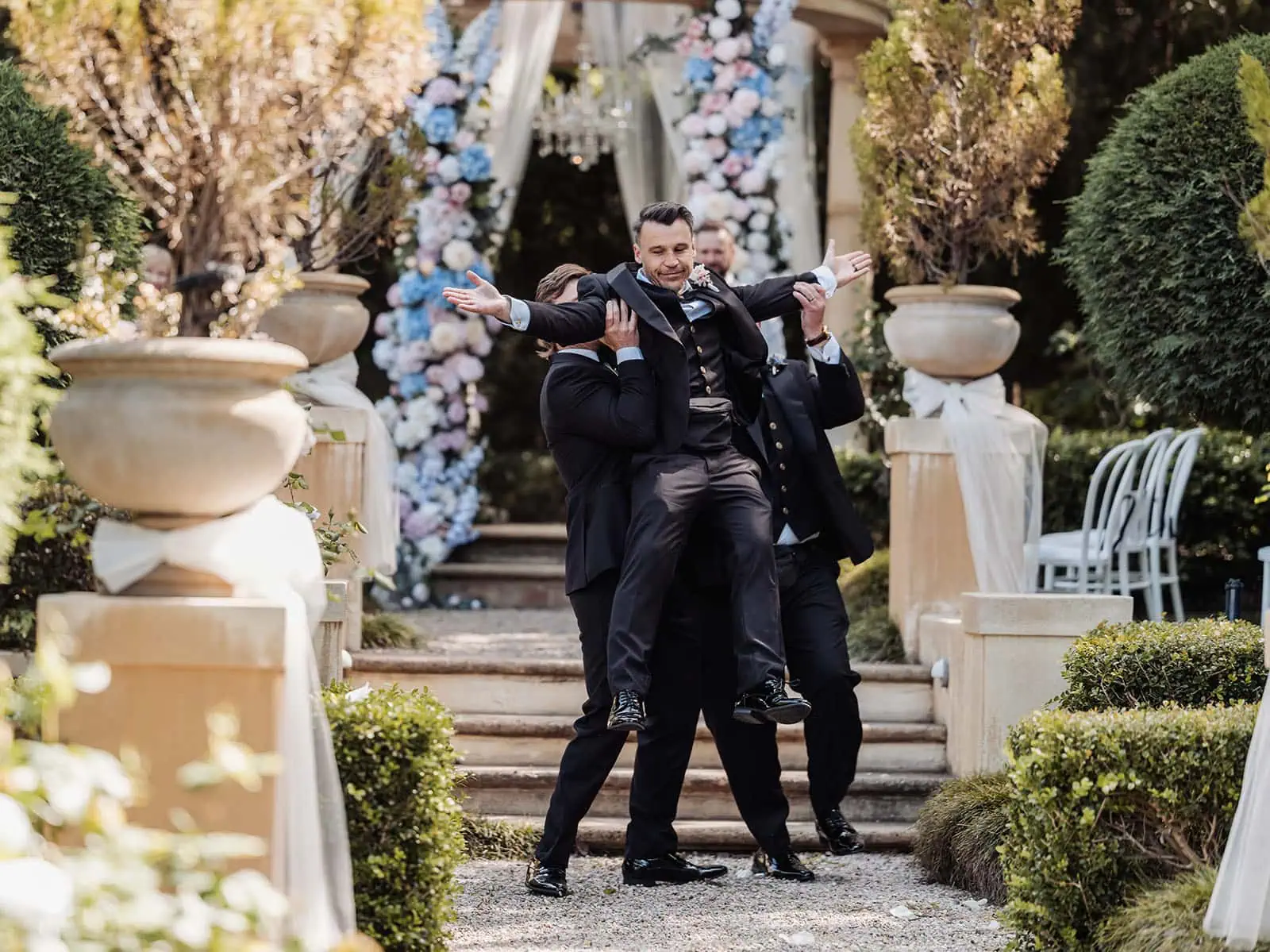 silvestris of clarendon wedding - sam & wayne 210 Groom lifted joyfully during reception, wedding celebration filled with happiness and laughter.