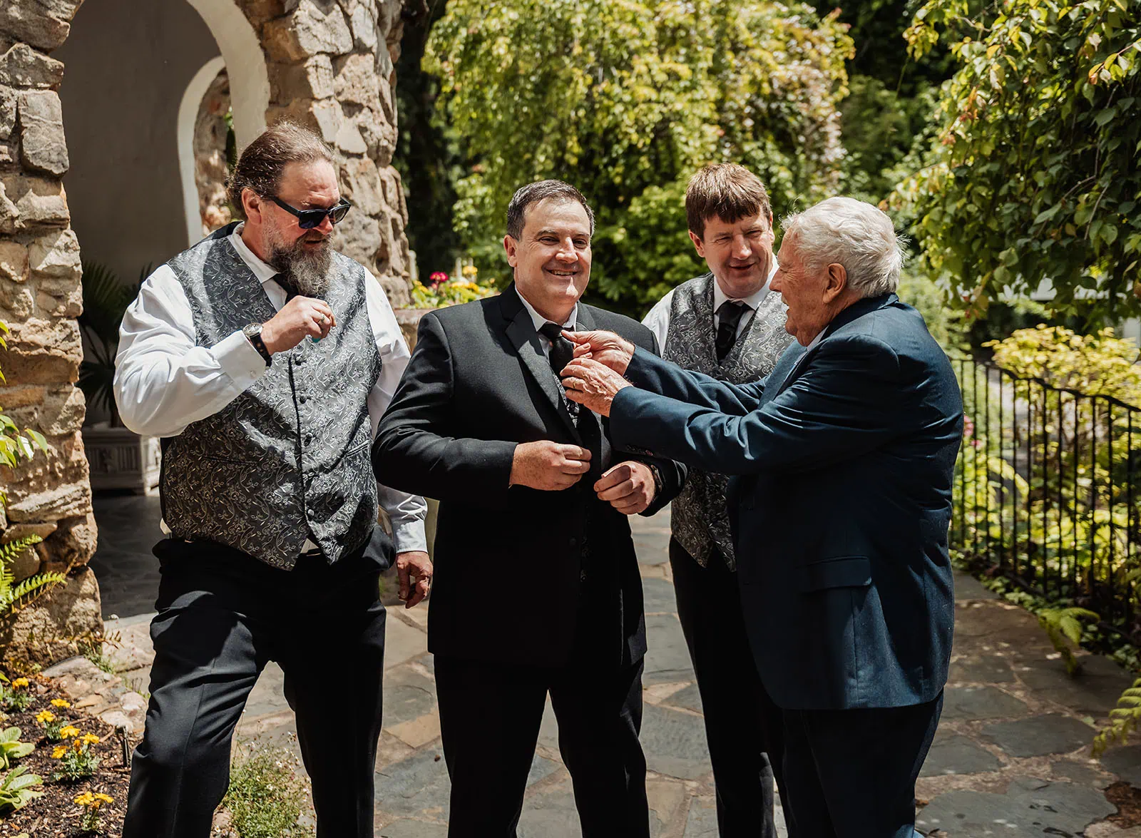 wedding at the manor in basket range - maryam & jason 116 Outdoor wedding celebration with joyful guests enjoying a sunny day.