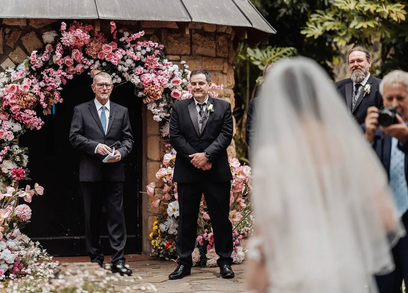 wedding at the manor in basket range - maryam & jason 133 Elegant gazebo adorned with flowers for a picturesque wedding ceremony.