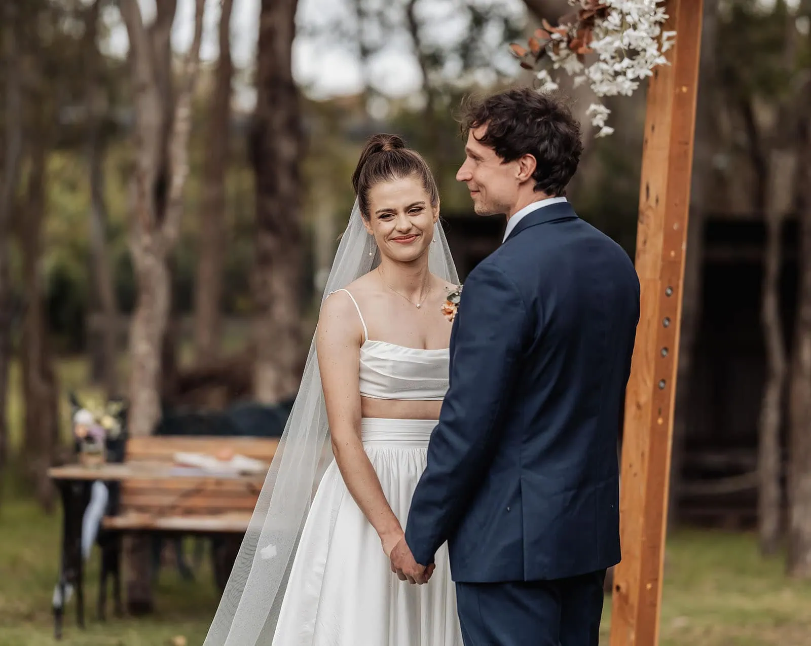 fleurieu cherries wedding - kimberley & richard 13 Bride and groom exchanging vows in a beautiful outdoor ceremony.