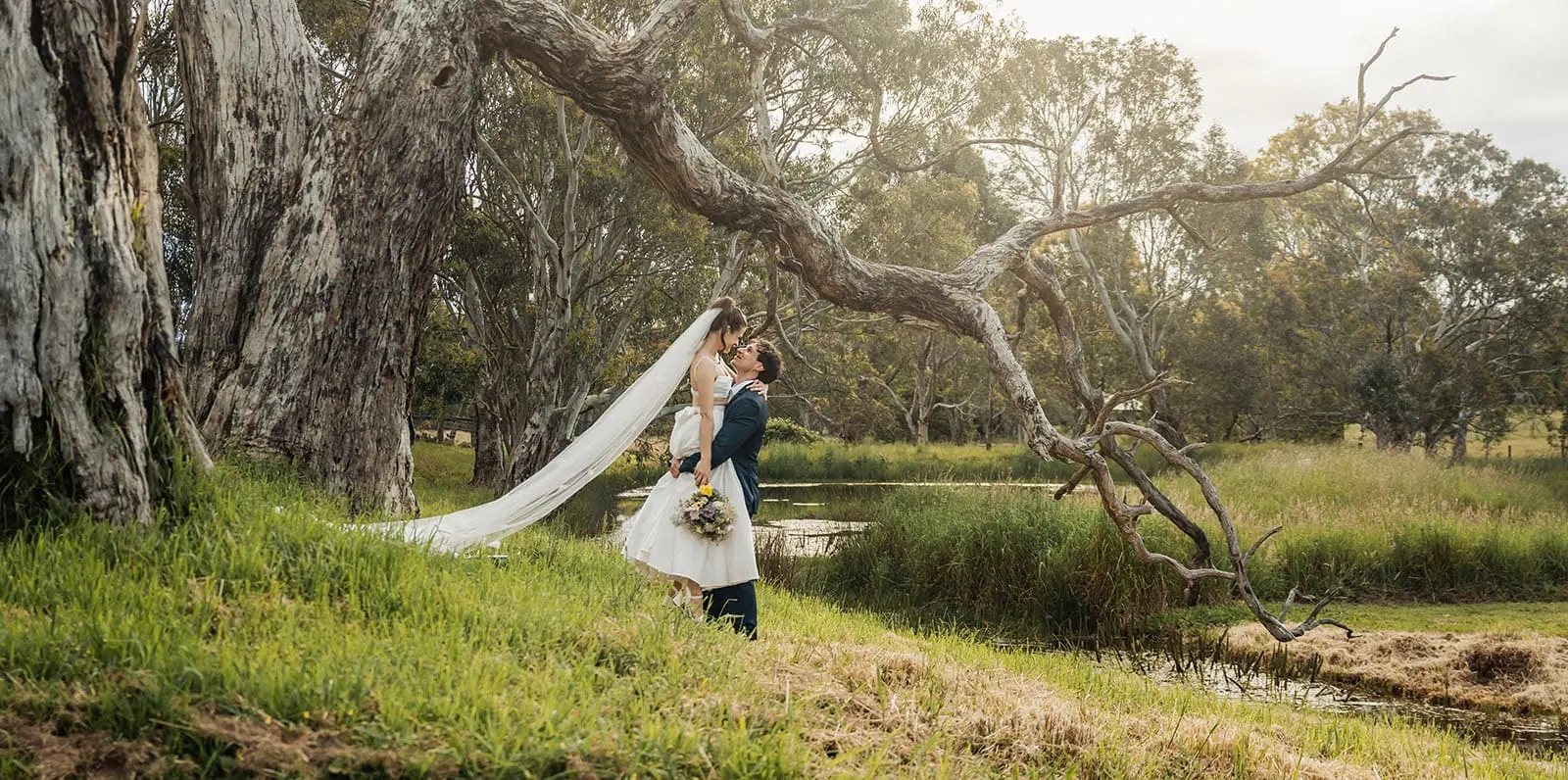 fleurieu cherries wedding - kimberley & richard 73 Romantic wedding couple embracing outdoors in nature.