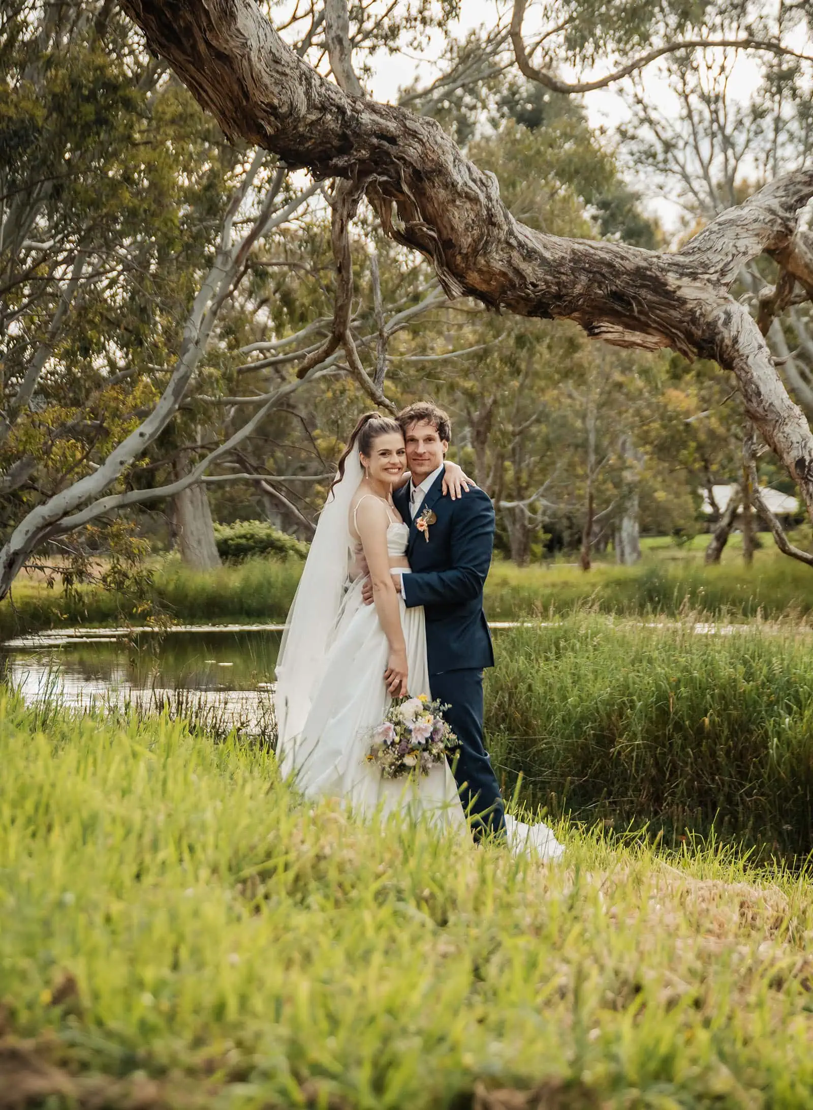 fleurieu cherries wedding - kimberley & richard 72 Elegant wedding couple in a peaceful outdoor setting.