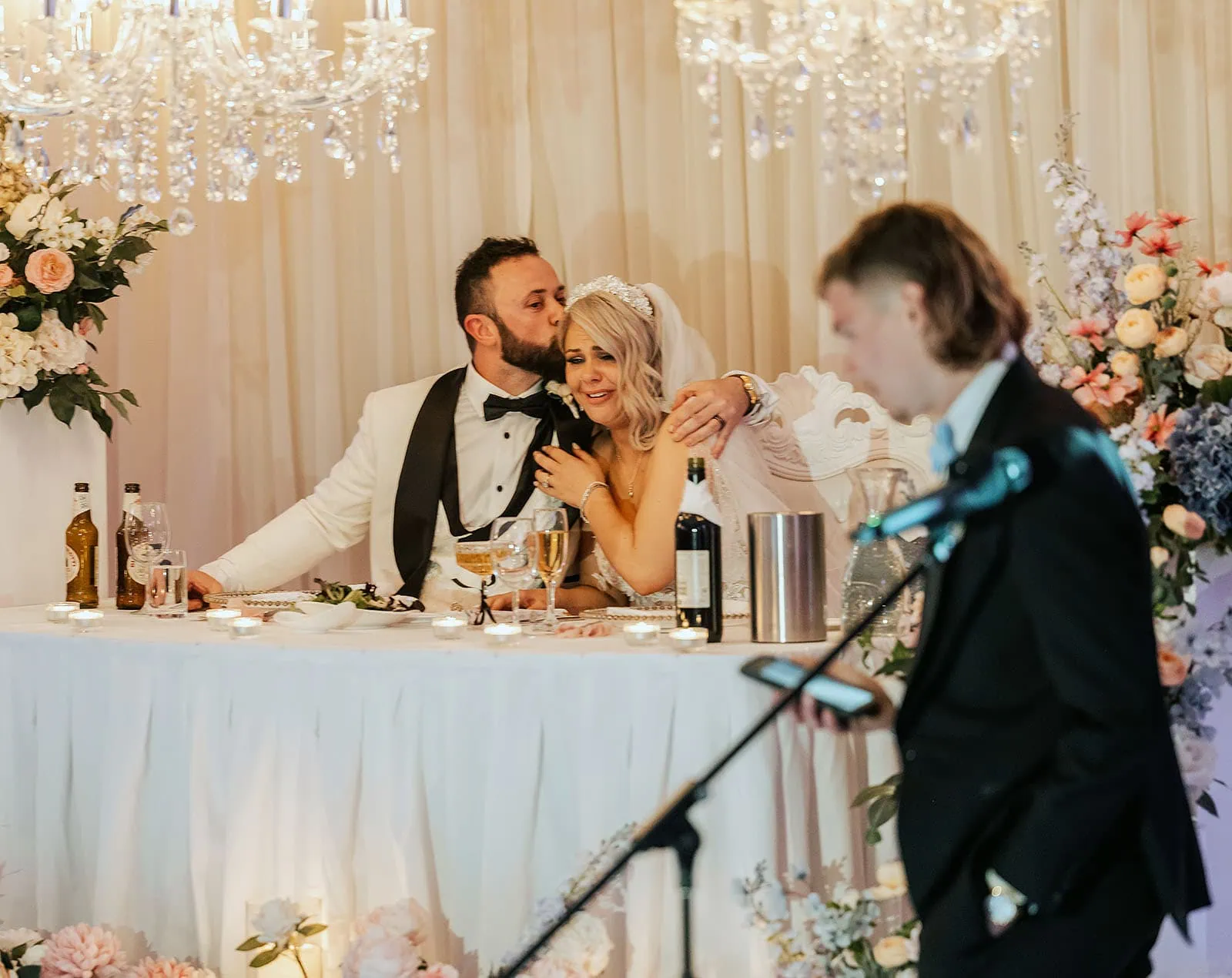 silvestris of clarendon wedding - sam & wayne 262 Bride and groom raising glasses in celebration at elegant wedding reception.