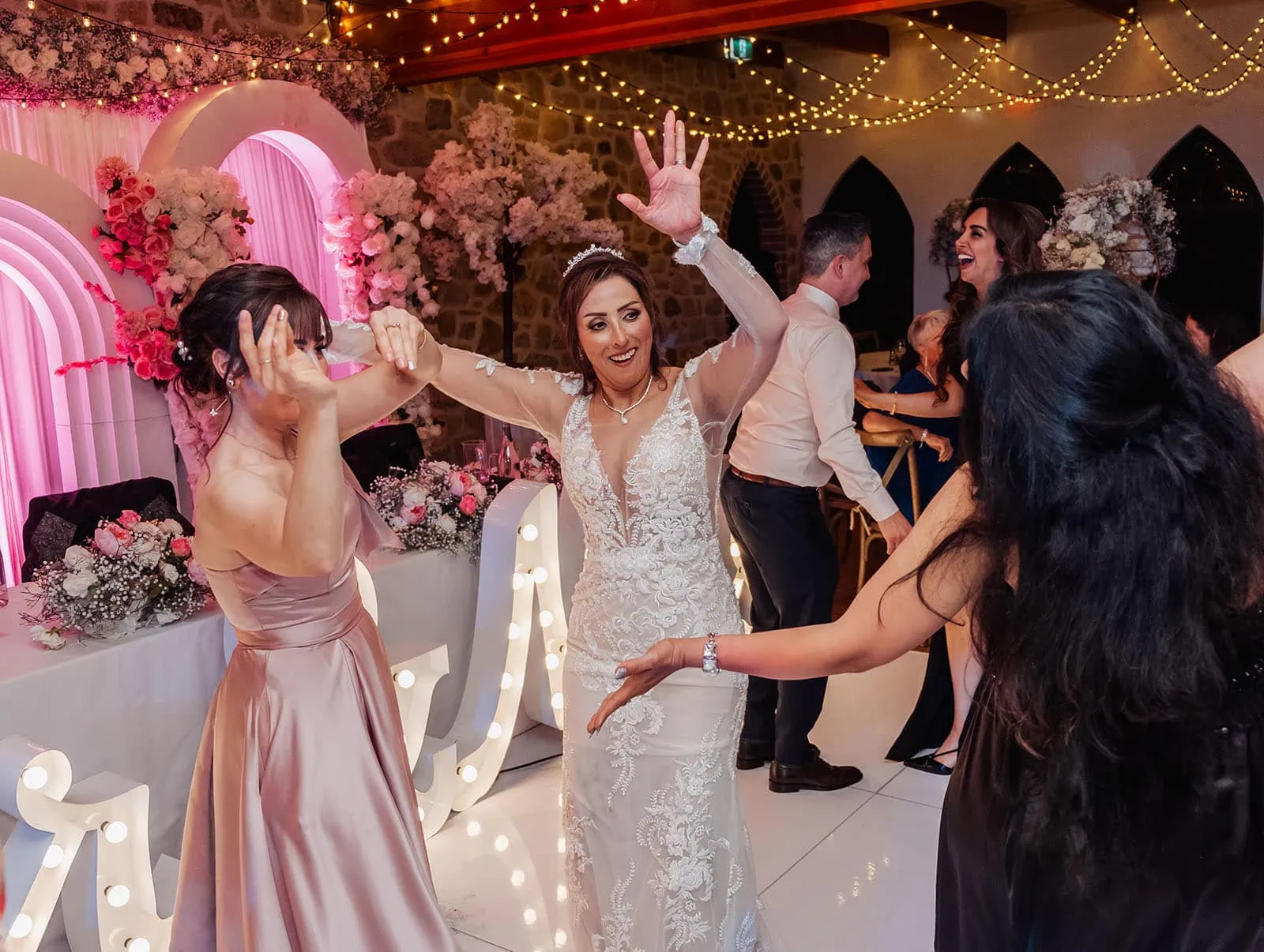 wedding at the manor in basket range - maryam & jason 175 Bride and groom joyful dance, wedding celebration moment.