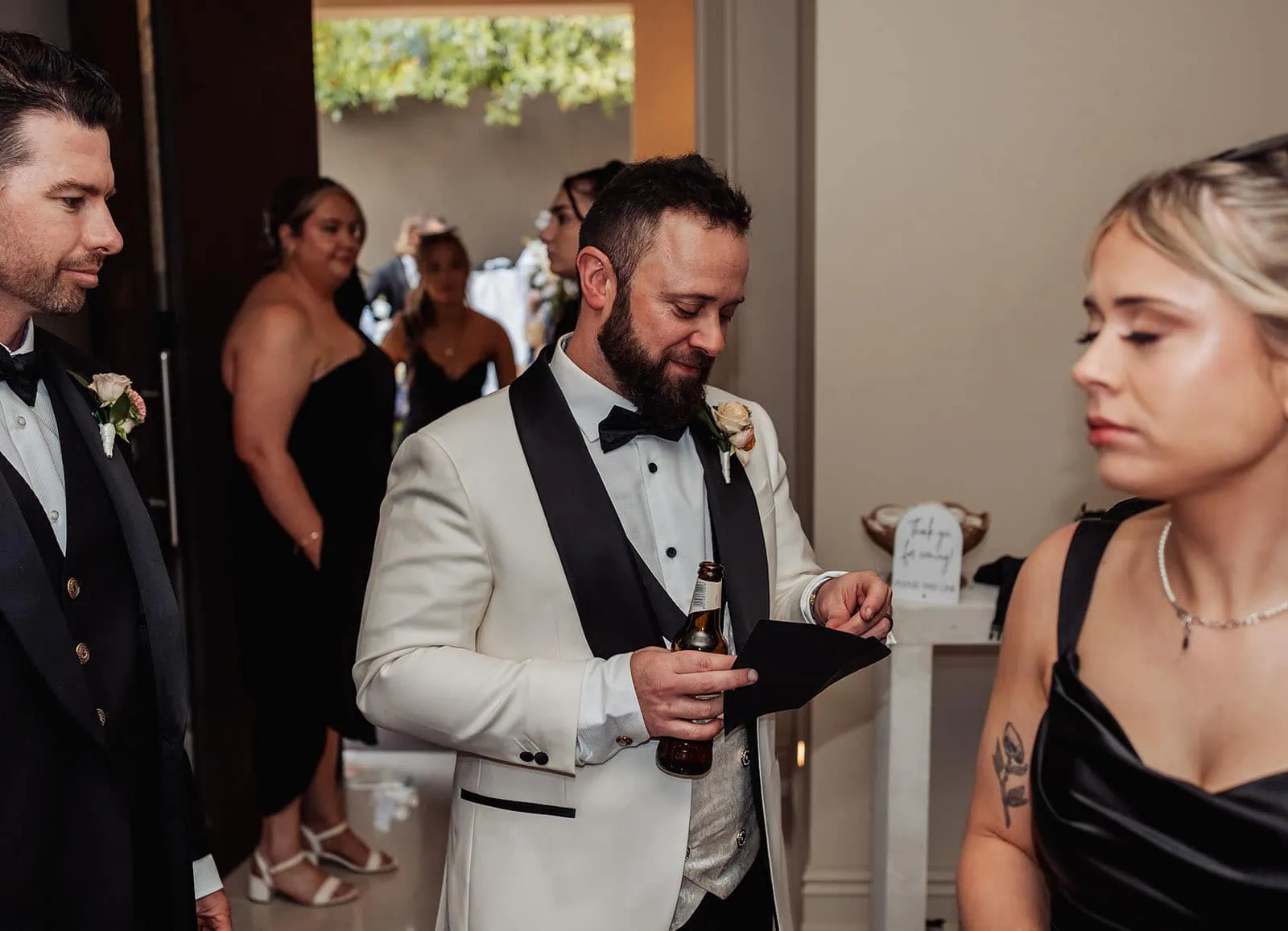 silvestris of clarendon wedding - sam & wayne 251 Elegant white tuxedo at a wedding event.