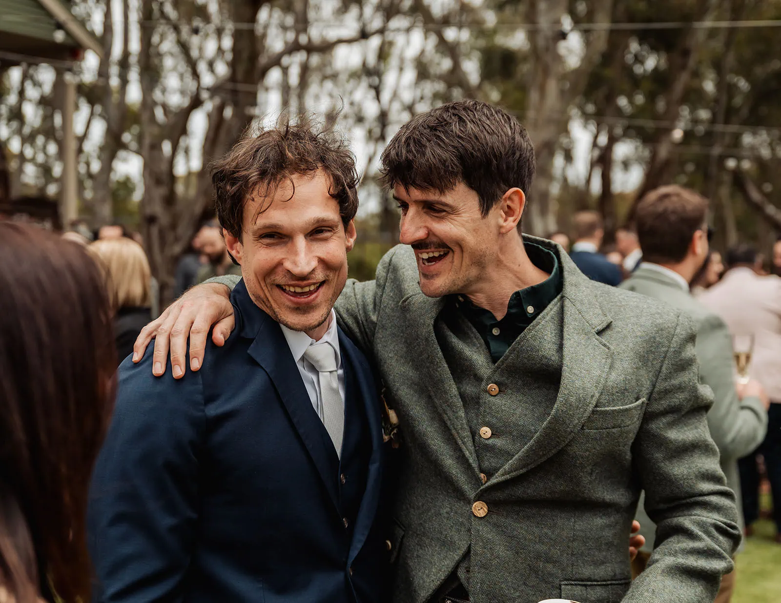 fleurieu cherries wedding - kimberley & richard 40 Friends celebrating joyously at a vibrant wedding ceremony.