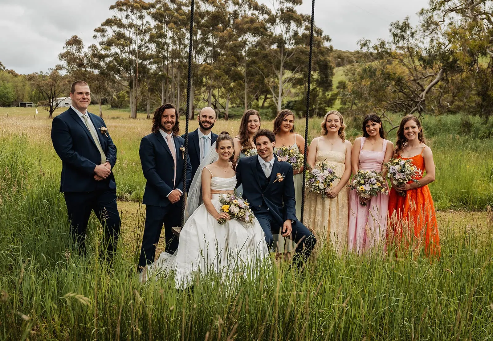 fleurieu cherries wedding - kimberley & richard 23 Outdoor wedding party celebrating joy and love amidst natures beautiful backdrop.