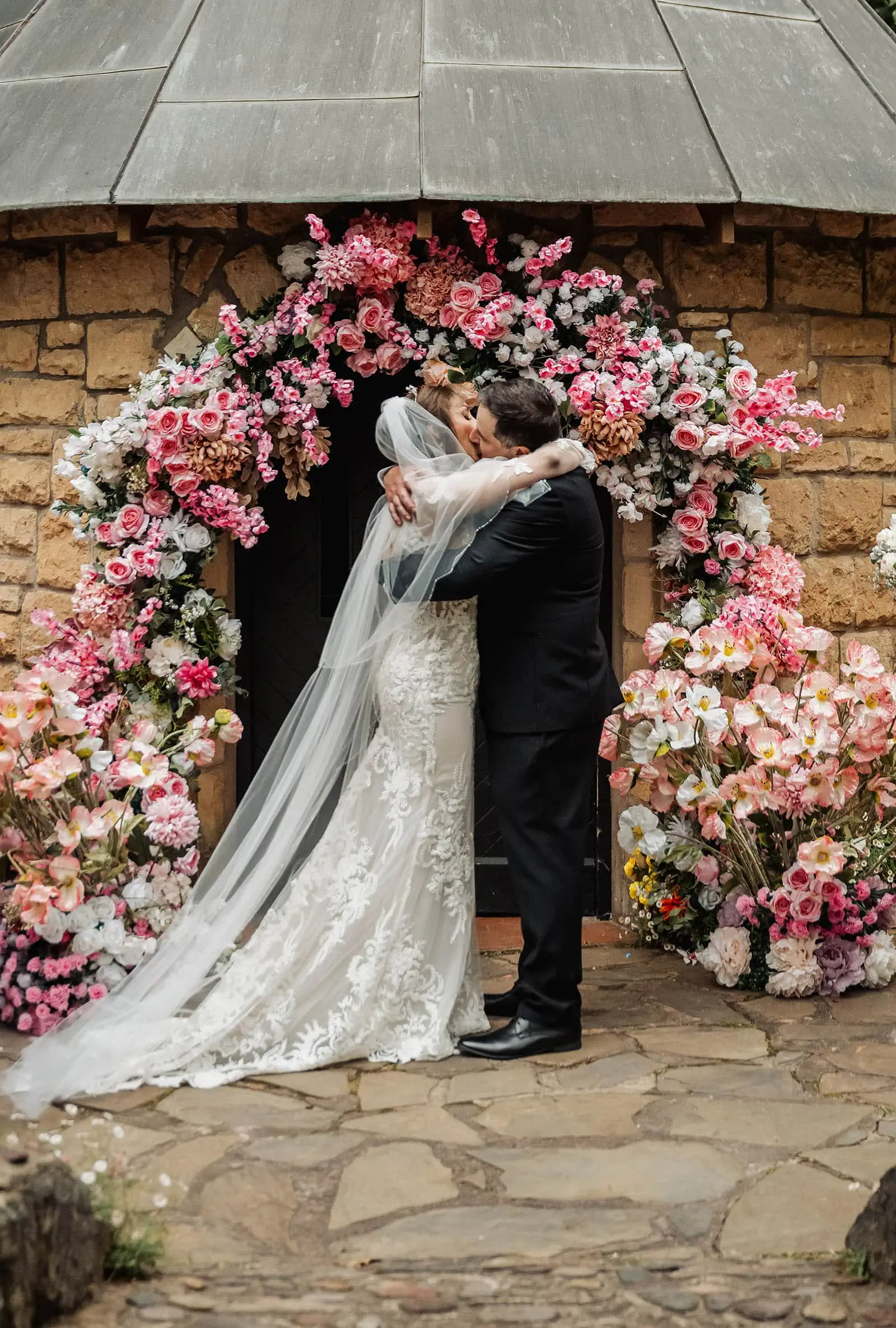 wedding at the manor in basket range - maryam & jason 138 Bride and groom share a romantic moment during wedding ceremony.