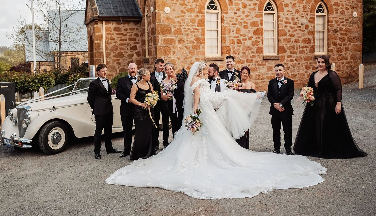 silvestris of clarendon wedding - sam & wayne 235 Rustic wedding decor with floral arrangements and wooden accents.