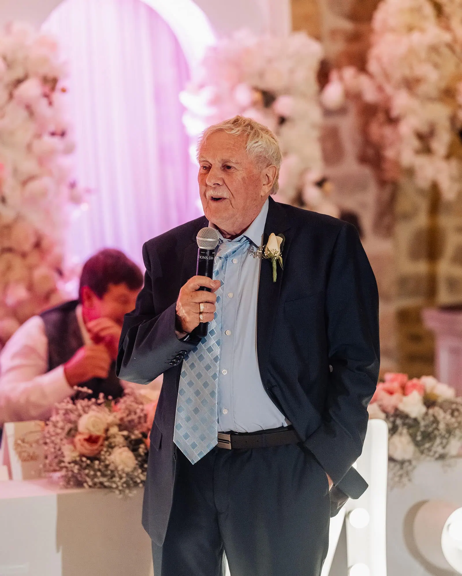 wedding at the manor in basket range - maryam & jason 168 Man giving wedding speech with microphone at reception.