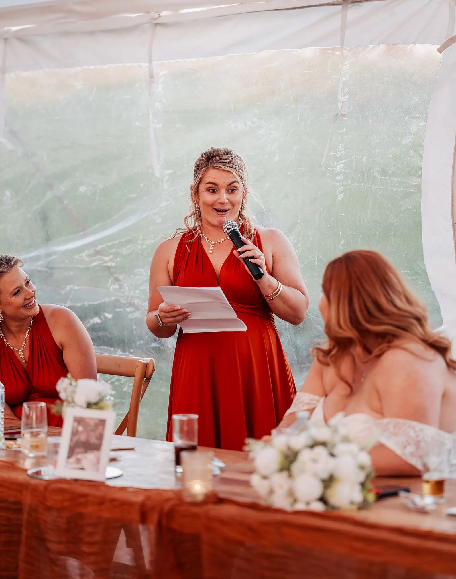 country victoria wedding in corrunnun – rachelle & anthony 364 Bridesmaid in elegant red dress giving memorable wedding toast at reception.