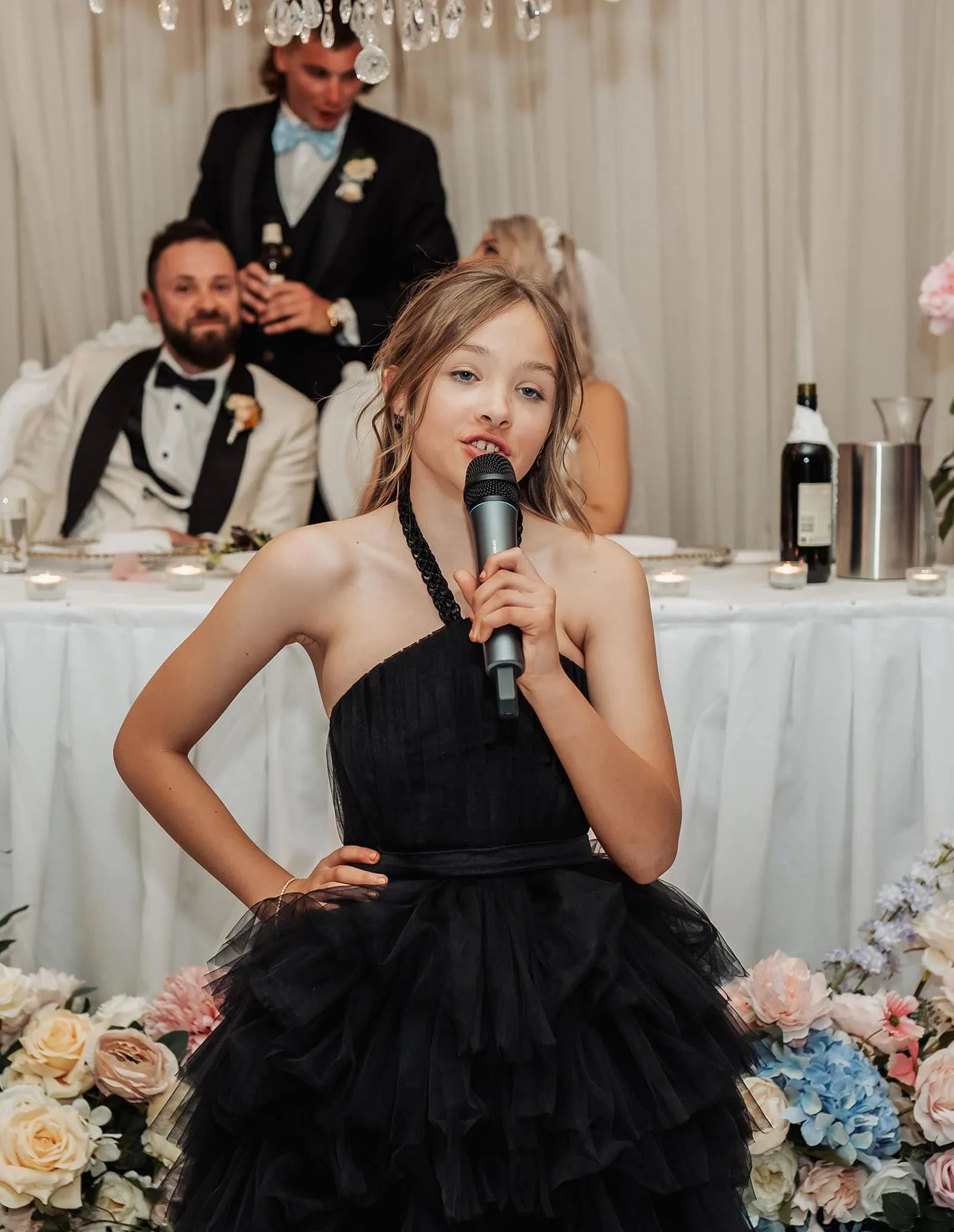 silvestris of clarendon wedding - sam & wayne 263 Young girl gives wedding toast, joyful celebration and smiles.