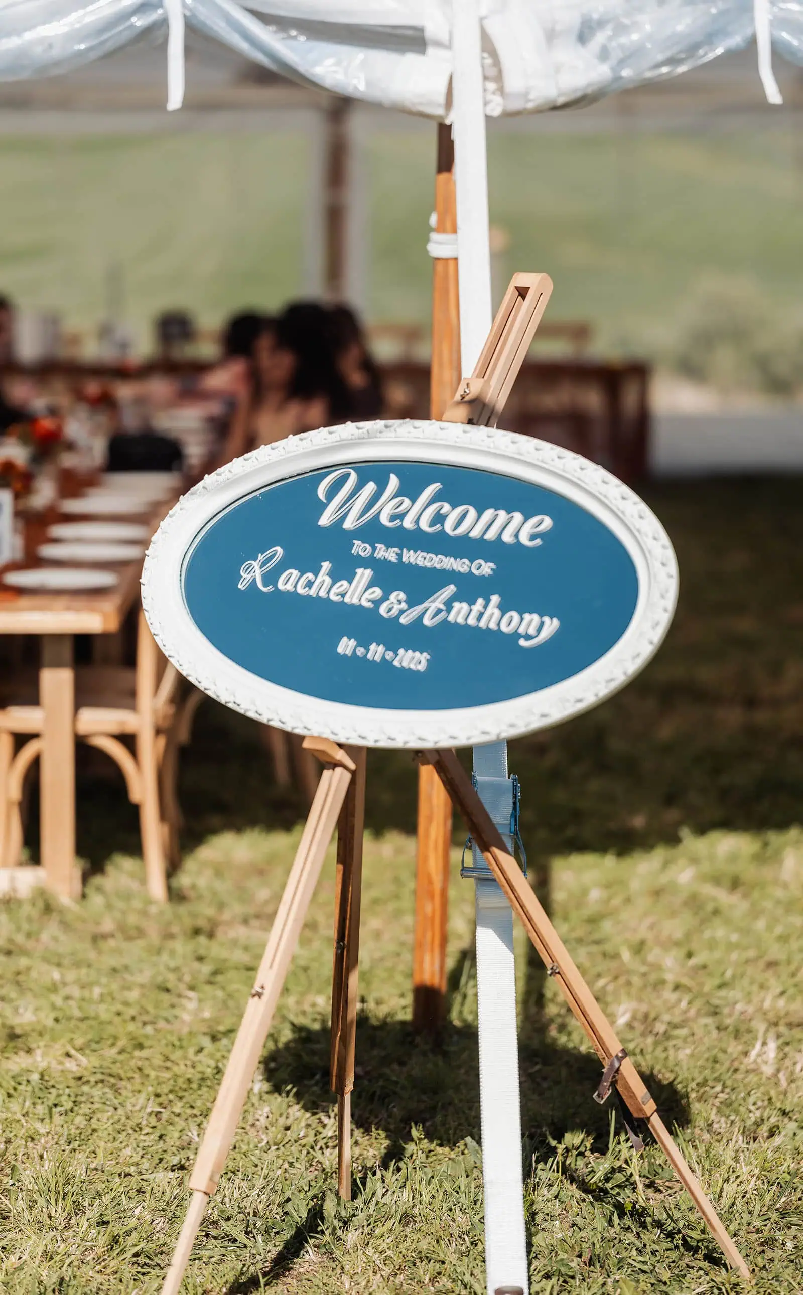 country victoria wedding in corrunnun – rachelle & anthony 359 Outdoor wedding welcome sign with flowers and greenery.