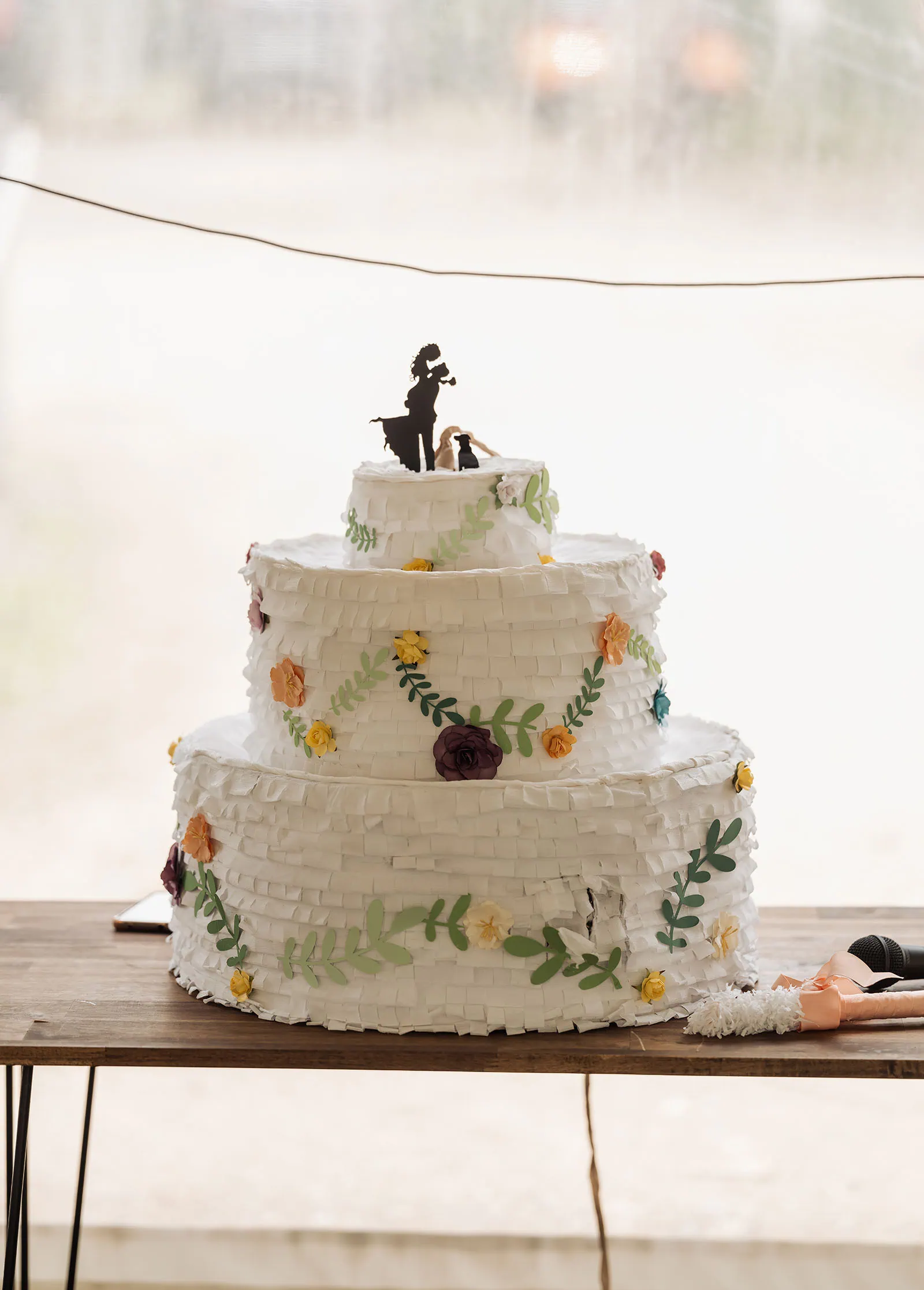 fleurieu cherries wedding - kimberley & richard 41 Whimsical wedding cake with floral decorations and unique design, perfect for modern celebrations.