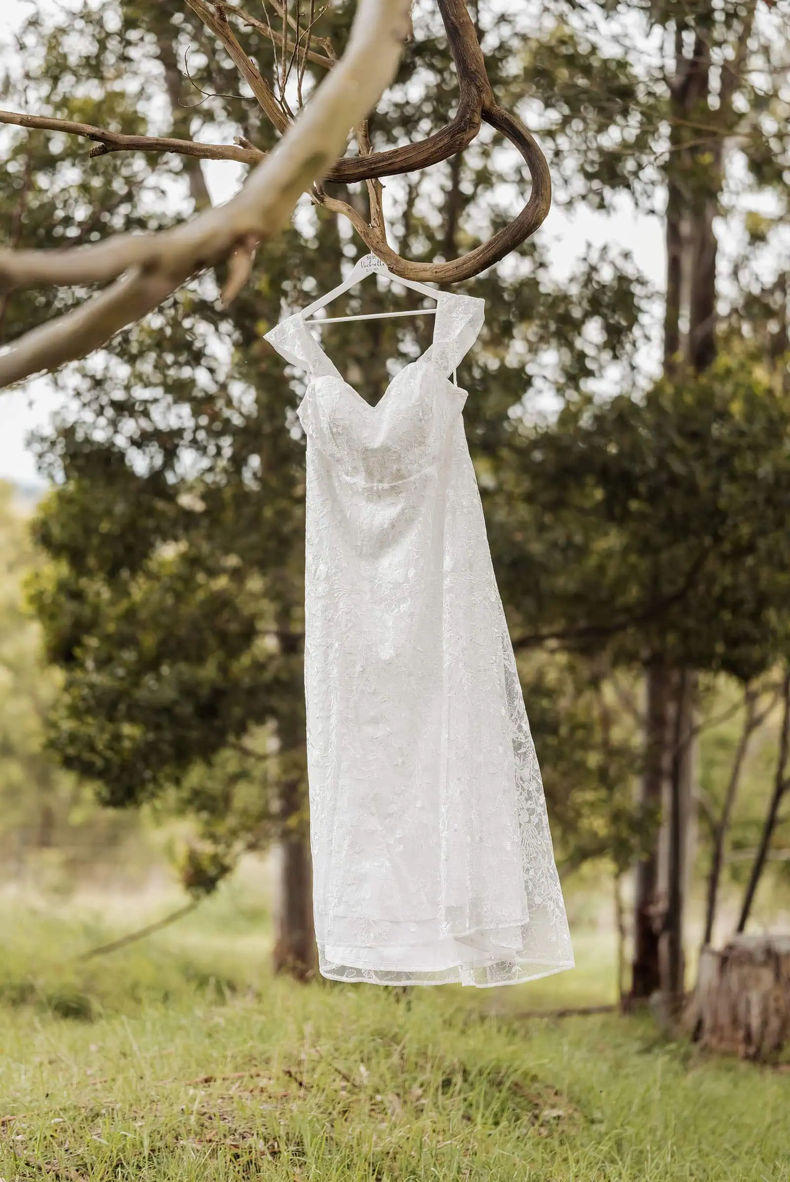 country victoria wedding in corrunnun – rachelle & anthony 297 Bride in elegant white wedding dress outdoors.