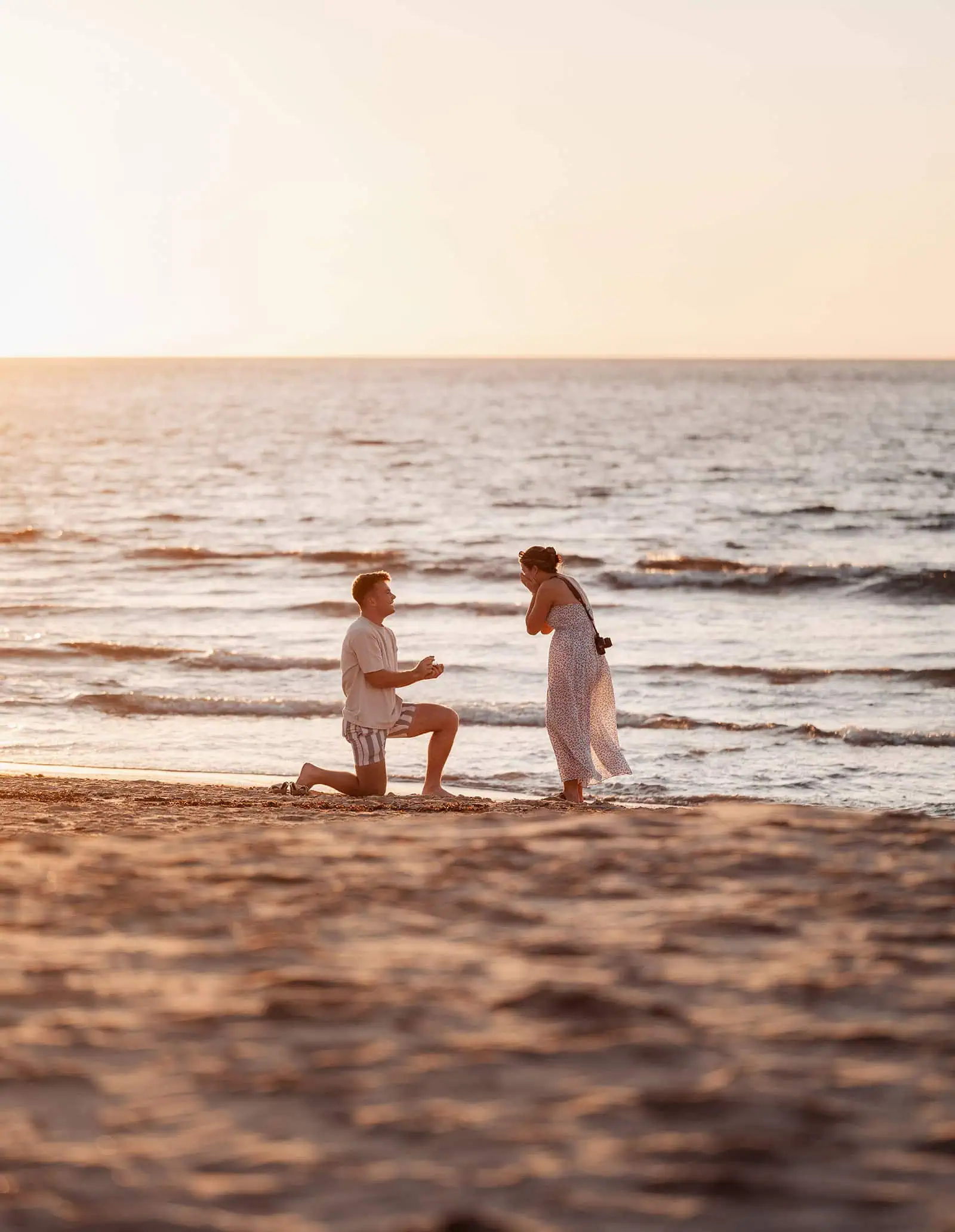 christies beach proposal – hollie & william 31 Couples beach proposal at sunset with romantic seaside backdrop.