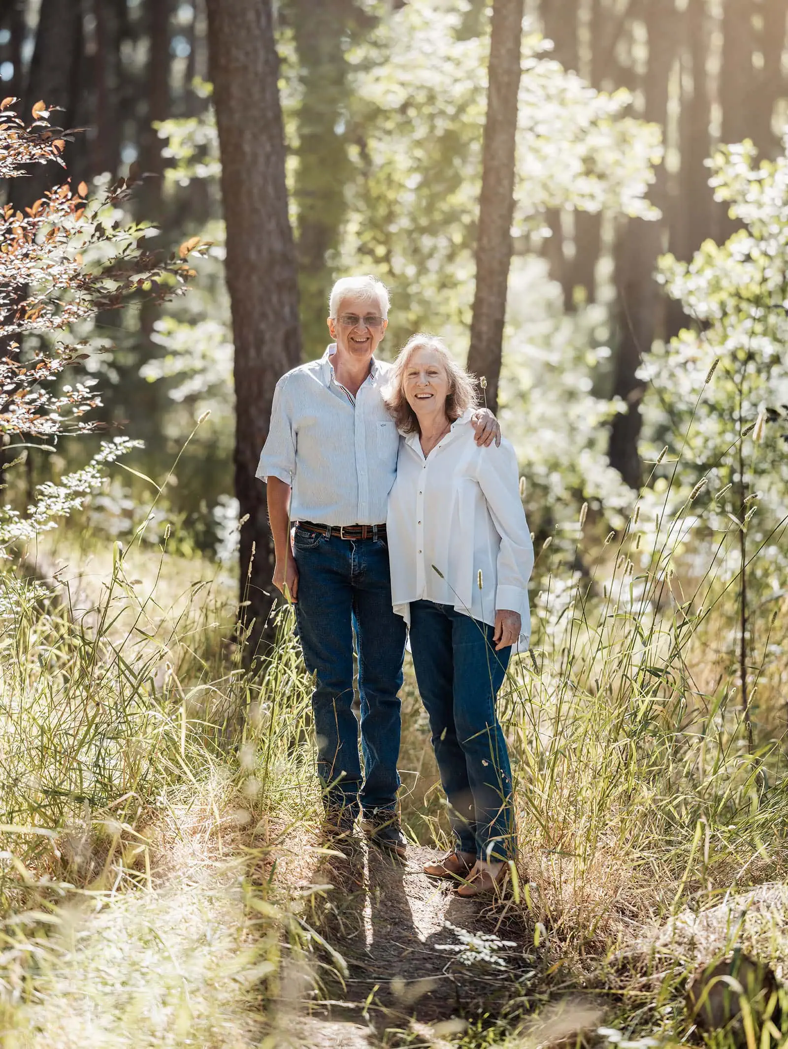 blackwood forest family photography 75 Older couple walking in forest, enjoying nature and sunlight together.