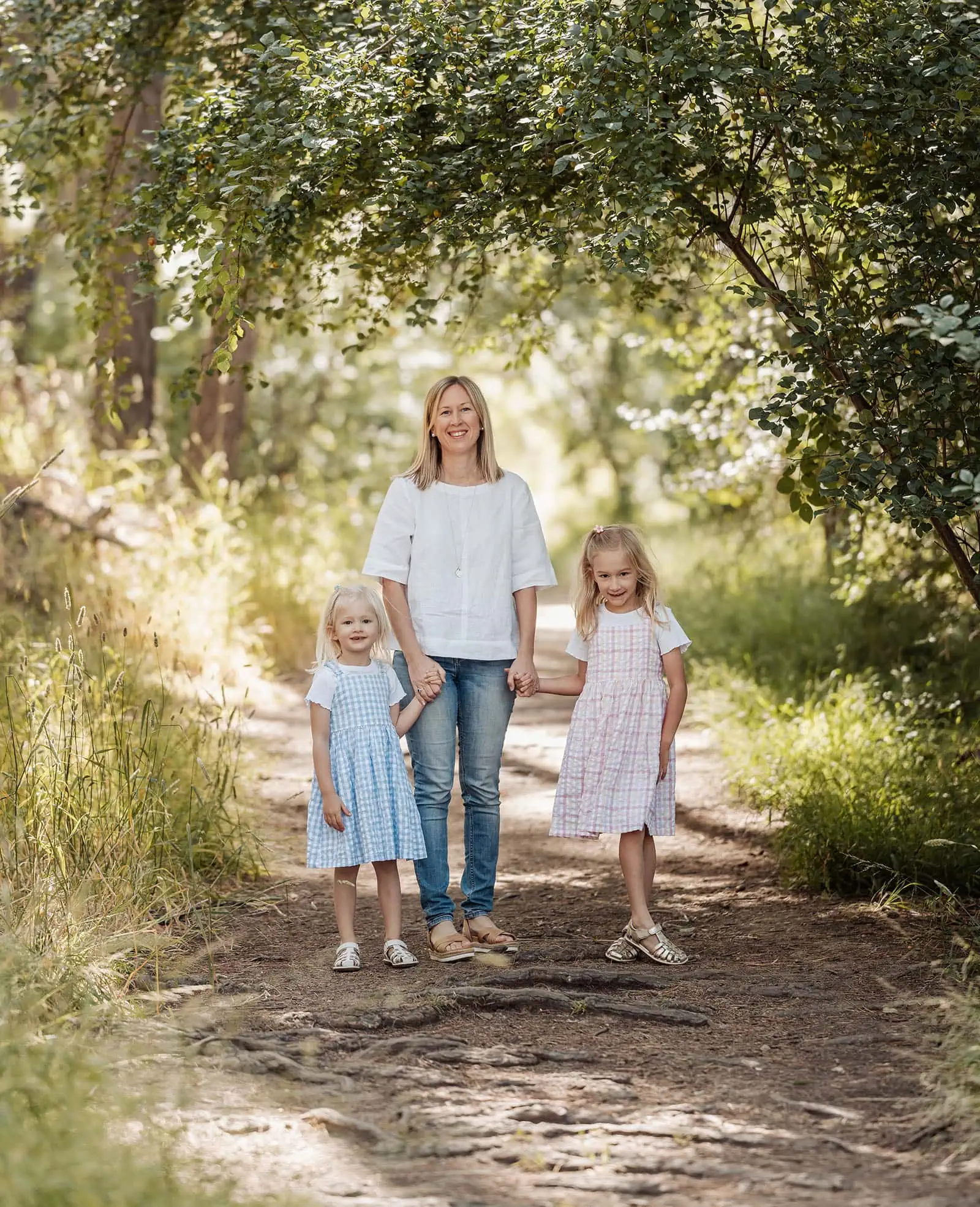 blackwood forest family photography 76 Family enjoying nature on a sunlit forest path.