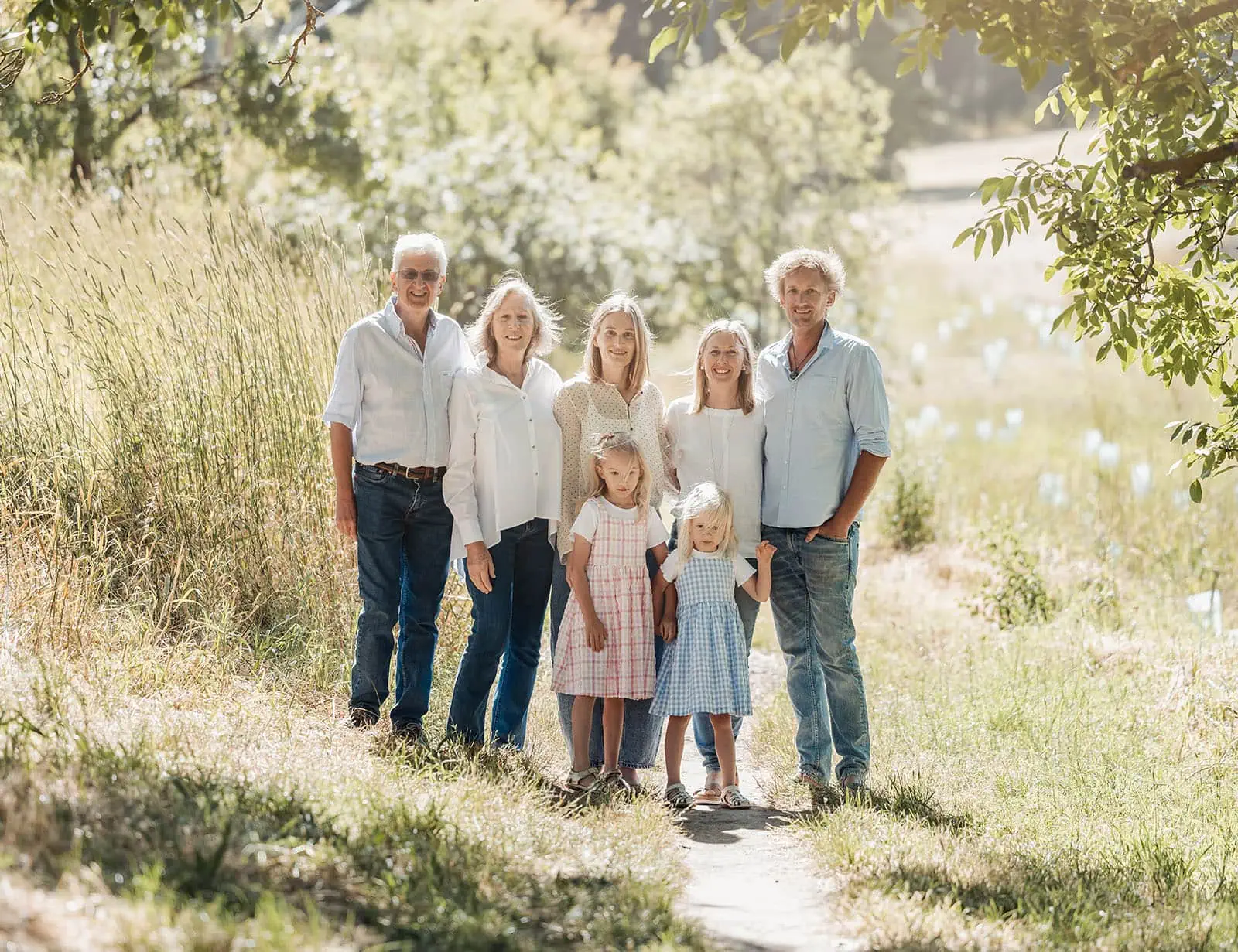 blackwood forest family photography 66 Three-generation family enjoys a sunny day outdoors, surrounded by greenery and harmony.