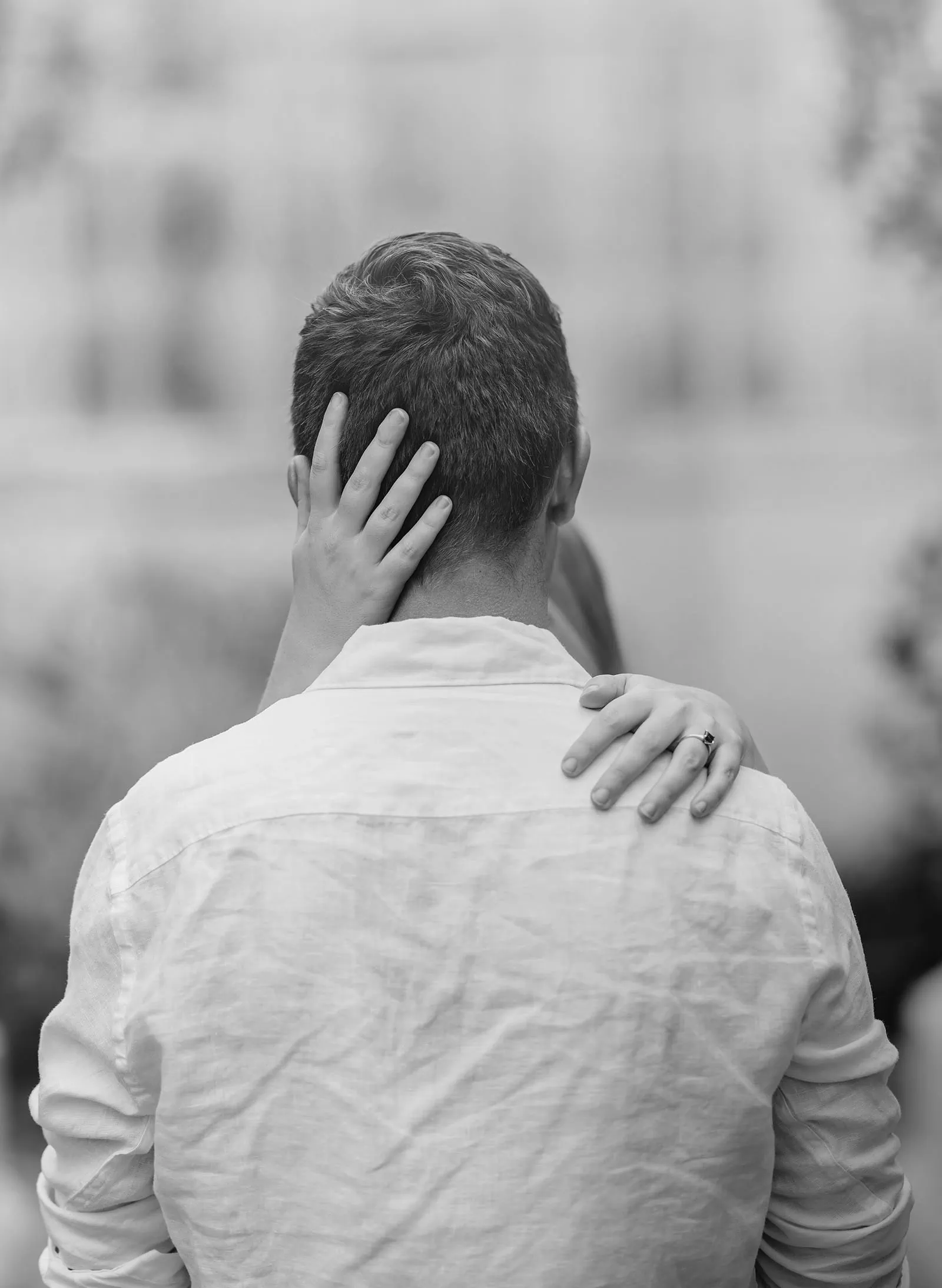botanic gardens wedding shoot - olivia & sean 9 Tender embrace between a couple in black and white, highlighting intimacy and connection.
