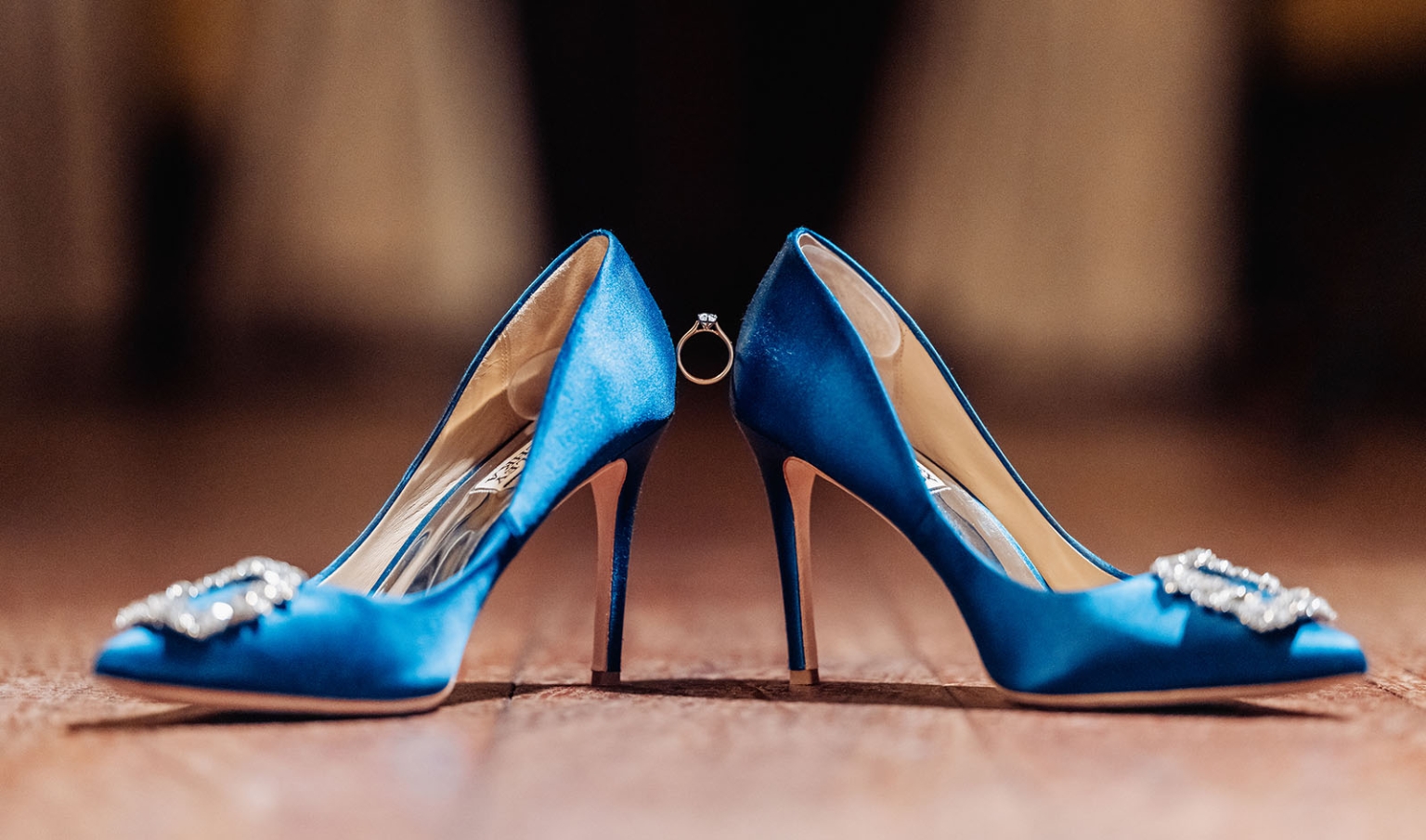 adelaide's st peter's cathedral wedding - irish & nick 58 Blue satin bridal heels with crystal embellishments and engagement ring on wooden floor.