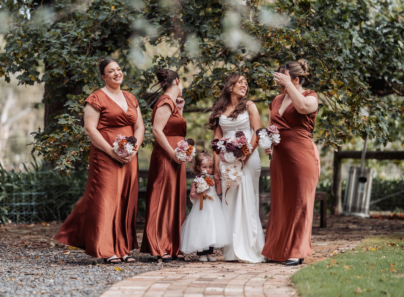 the lane vineyard wedding - caitlyn & craig 94 Bride with bridesmaids and flower girl in a garden wedding celebration.