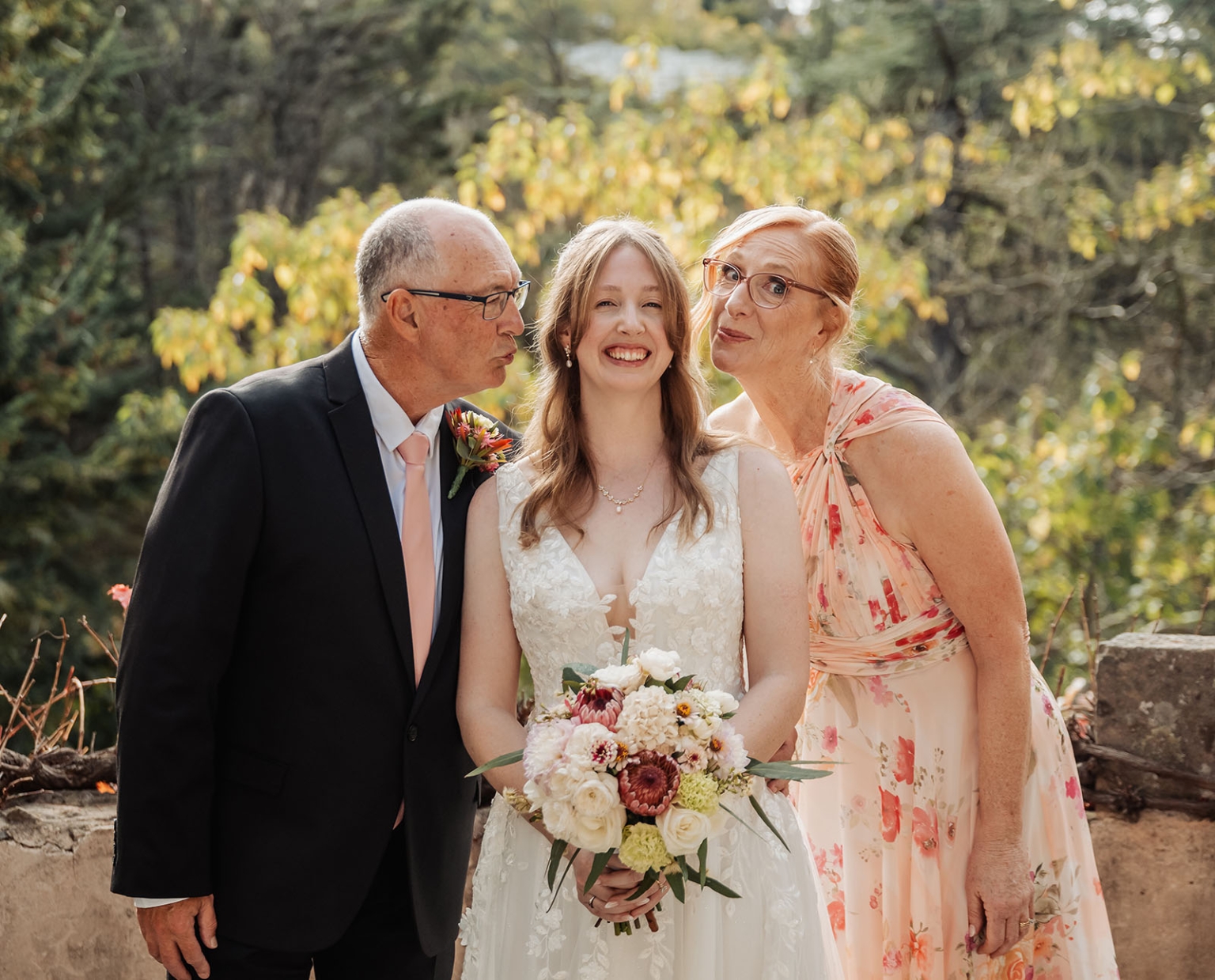 beautiful manor basket range wedding - sophie & theodore 97 Bride with family in garden wedding, smiling joyfully.