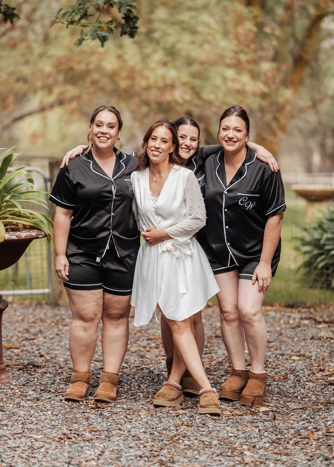 the lane vineyard wedding - caitlyn & craig 82 Bride and bridesmaids in joyous, relaxed outdoor setting, pre-wedding preparation.