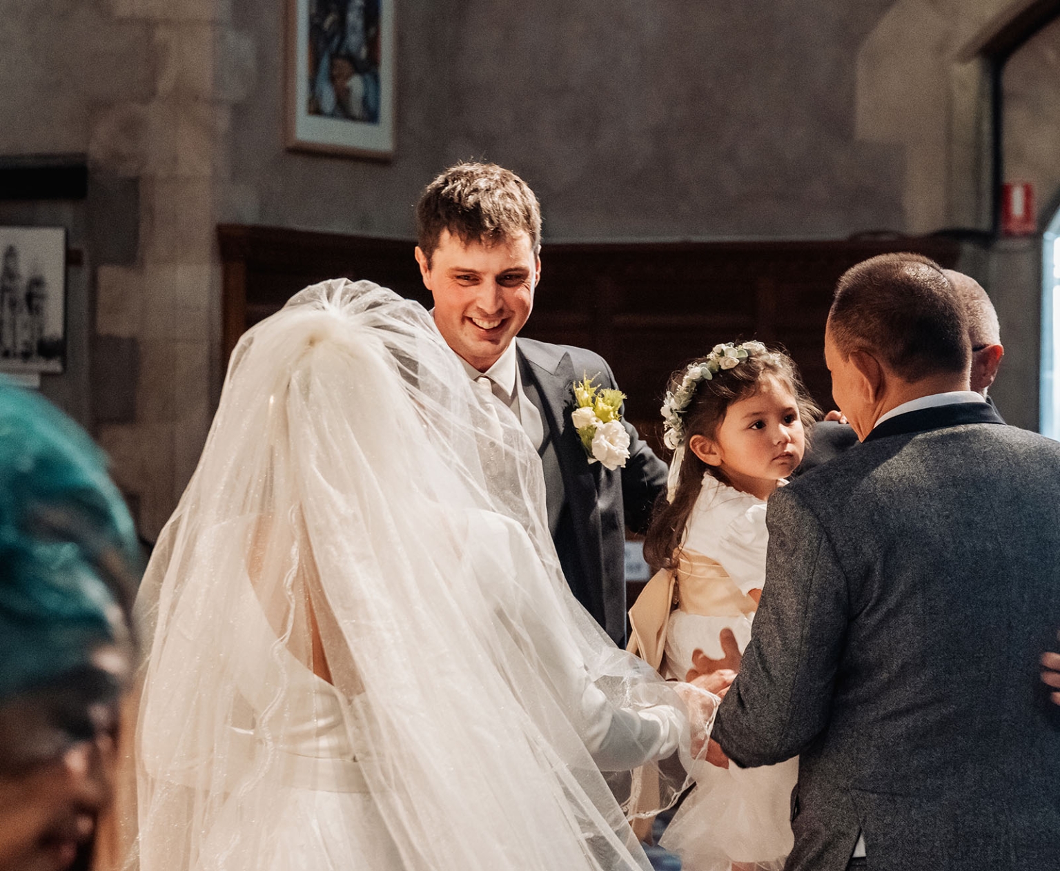 adelaide's st peter's cathedral wedding - irish & nick 15 Bride, groom, and flower girl during a church wedding ceremony.