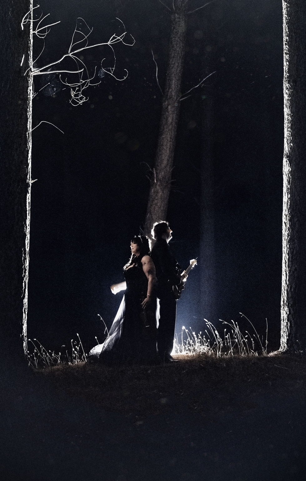 kuitpo forest metal themed wedding – erin & michael 39 Gothic forest silhouettes with guitar in dramatic nighttime backlight.