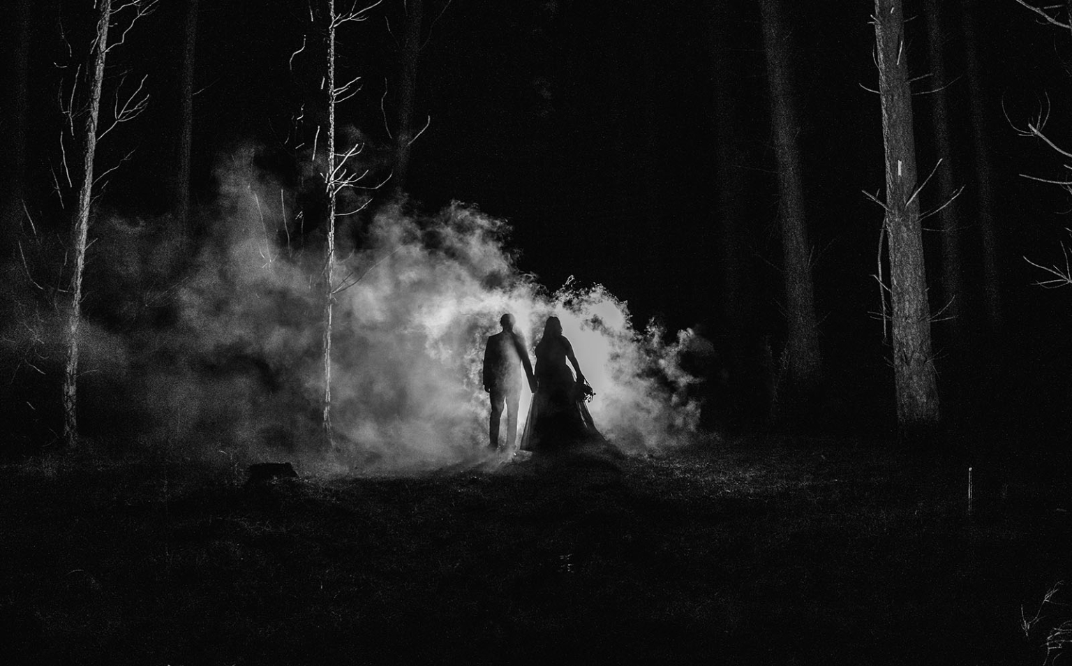kuitpo forest metal themed wedding – erin & michael 36 Foggy forest wedding silhouette of couple holding hands in dramatic black and white.