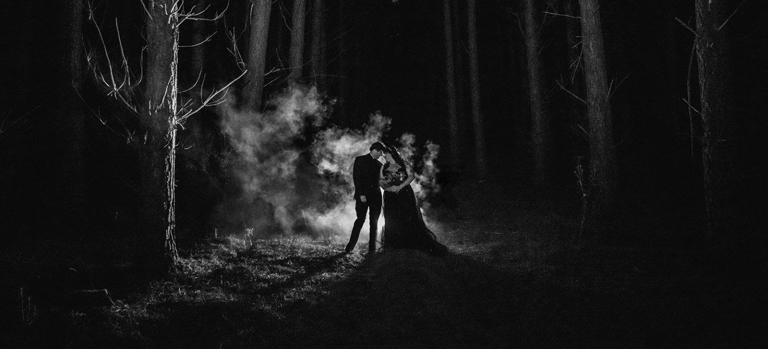 kuitpo forest metal themed wedding – erin & michael 34 Dramatic black and white forest wedding portrait of couple embracing in mist.