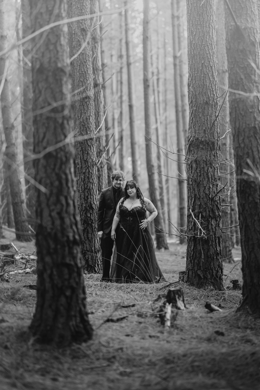 kuitpo forest metal themed wedding – erin & michael 19 Gothic couple portrait in misty forest with towering trees.