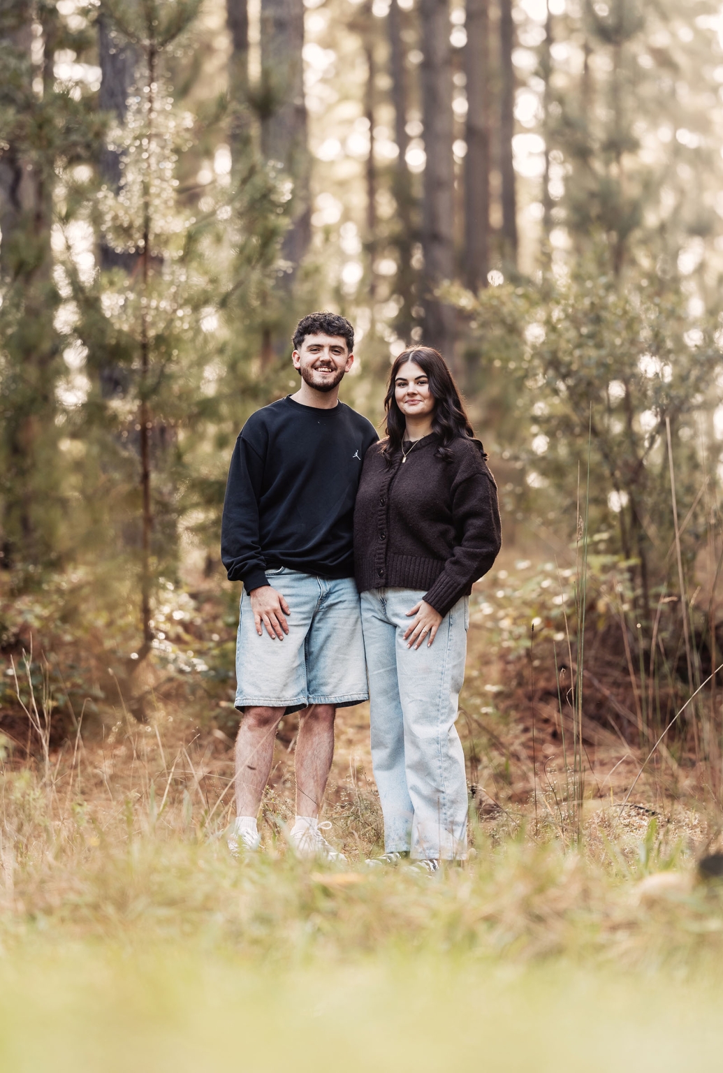 cabn at kuitpo forest proposal - tamsyn & blake 23 Couple enjoying serene forest setting with sunlight filtering through trees.