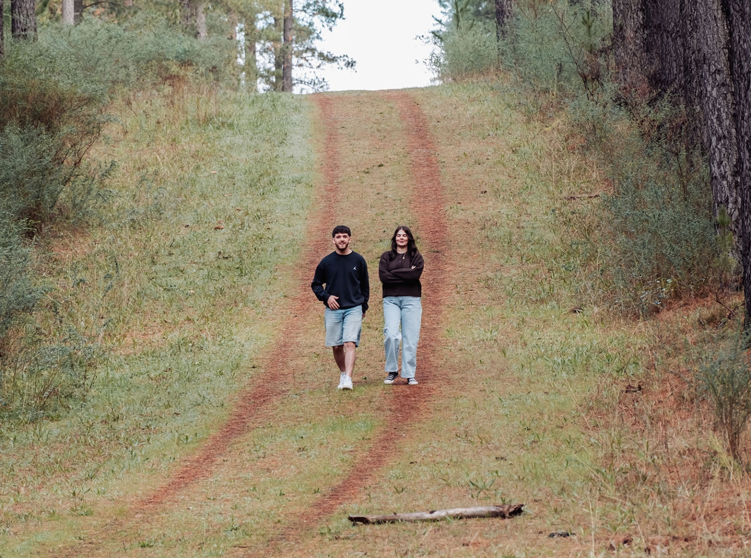 cabn at kuitpo forest proposal - tamsyn & blake 5 Man and woman walking on forest trail, surrounded by greenery and trees.