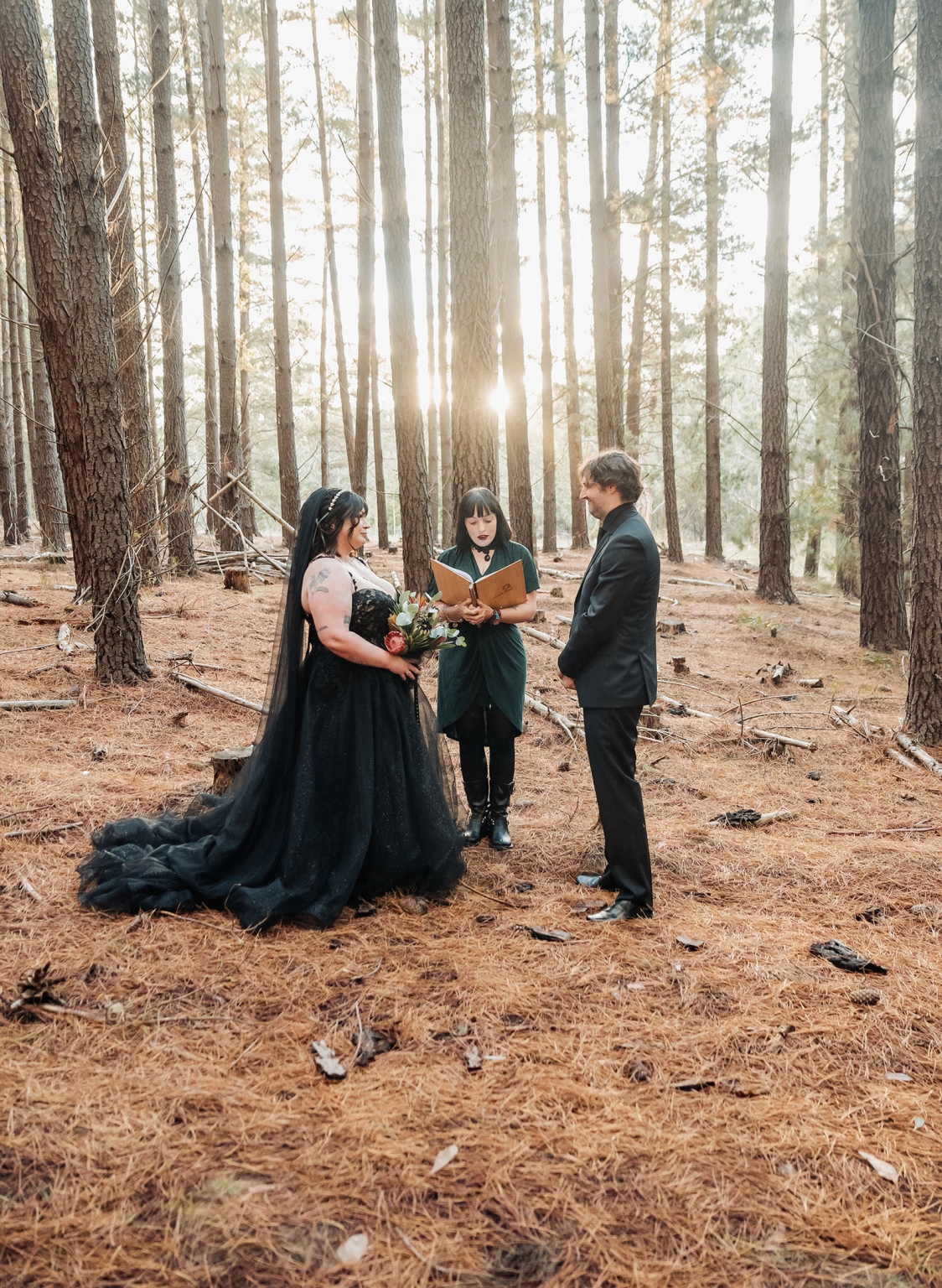 kuitpo forest metal themed wedding – erin & michael 6 Gothic forest wedding ceremony with black dress bride, groom, and officiant.