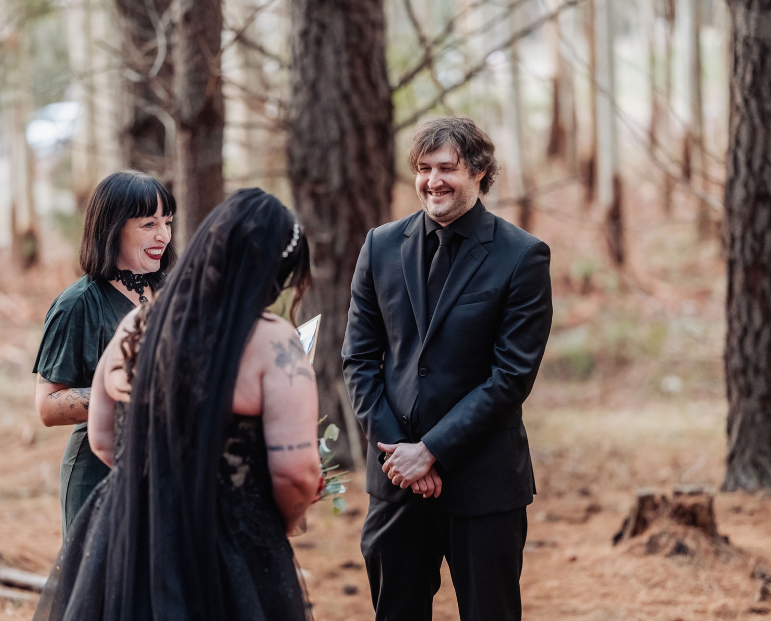 kuitpo forest metal themed wedding – erin & michael 8 Gothic forest wedding ceremony with bride in black veil and smiling groom.