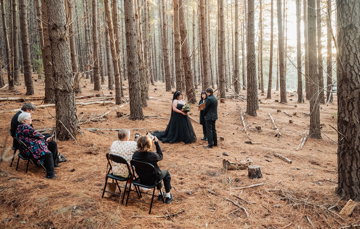 kuitpo forest metal themed wedding – erin & michael 9 Intimate forest wedding ceremony with bride in black gown and guests.