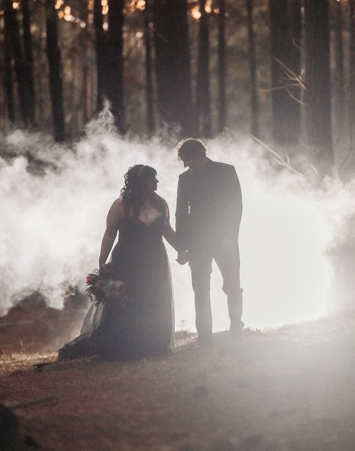 kuitpo forest metal themed wedding – erin & michael 30 Silhouetted bride and groom in misty forest wedding portrait.