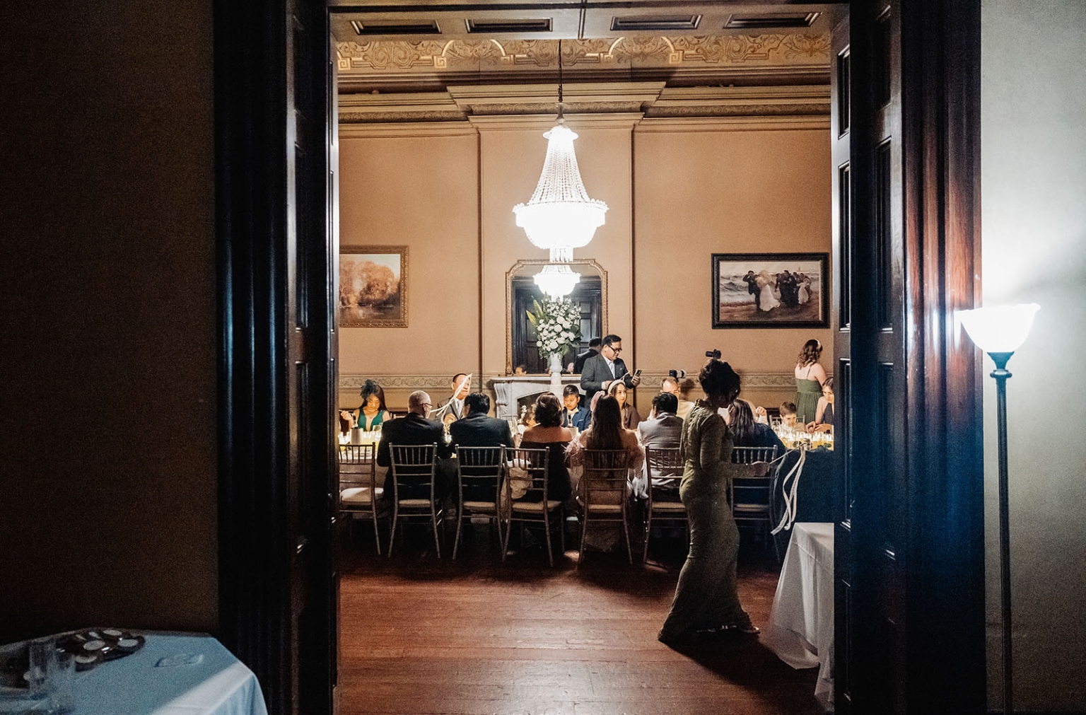 adelaide's st peter's cathedral wedding - irish & nick 54 Elegant formal dinner reception in historic dining room with chandelier and guests.