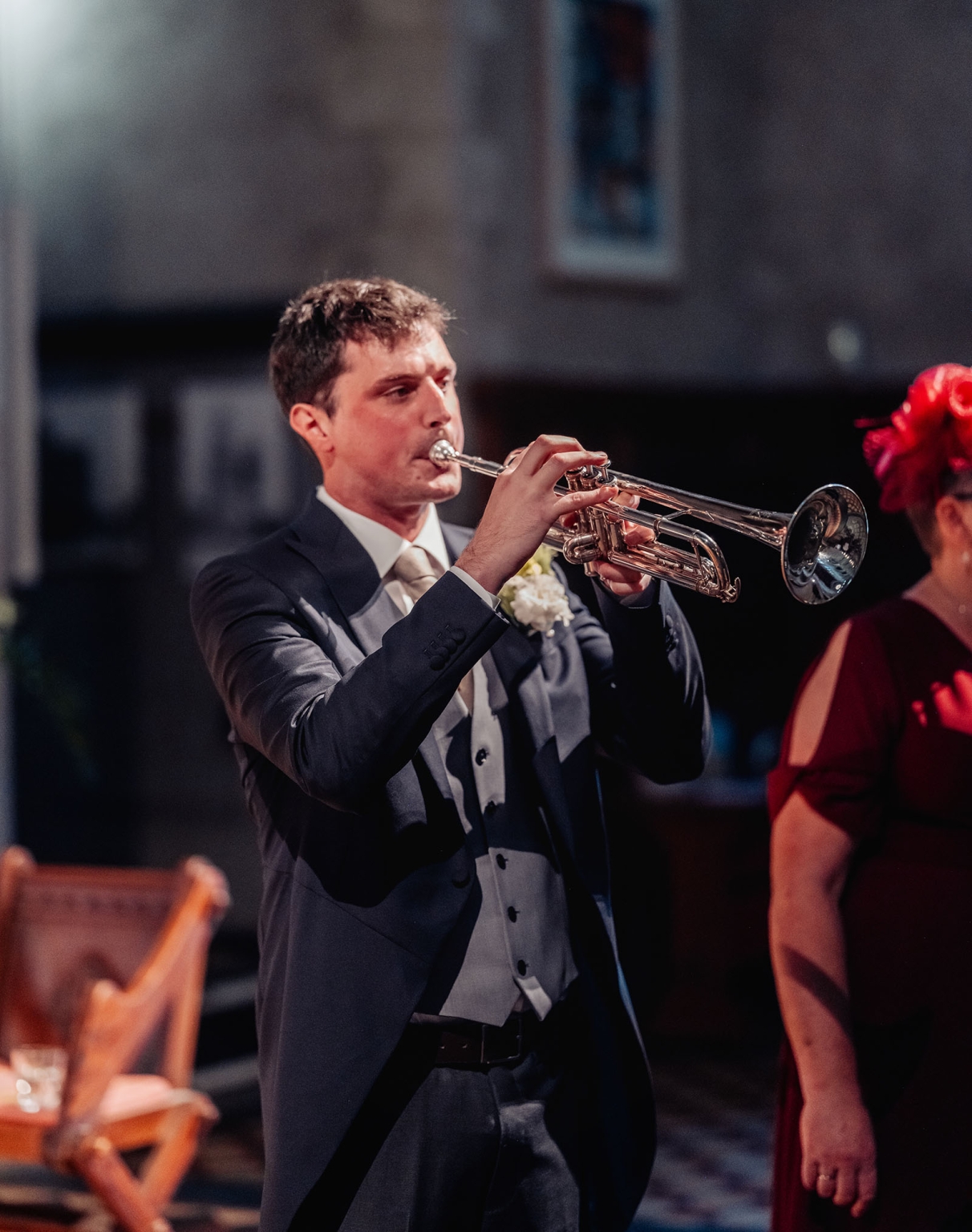adelaide's st peter's cathedral wedding - irish & nick 13 Formal trumpet player performs during elegant indoor wedding ceremony.