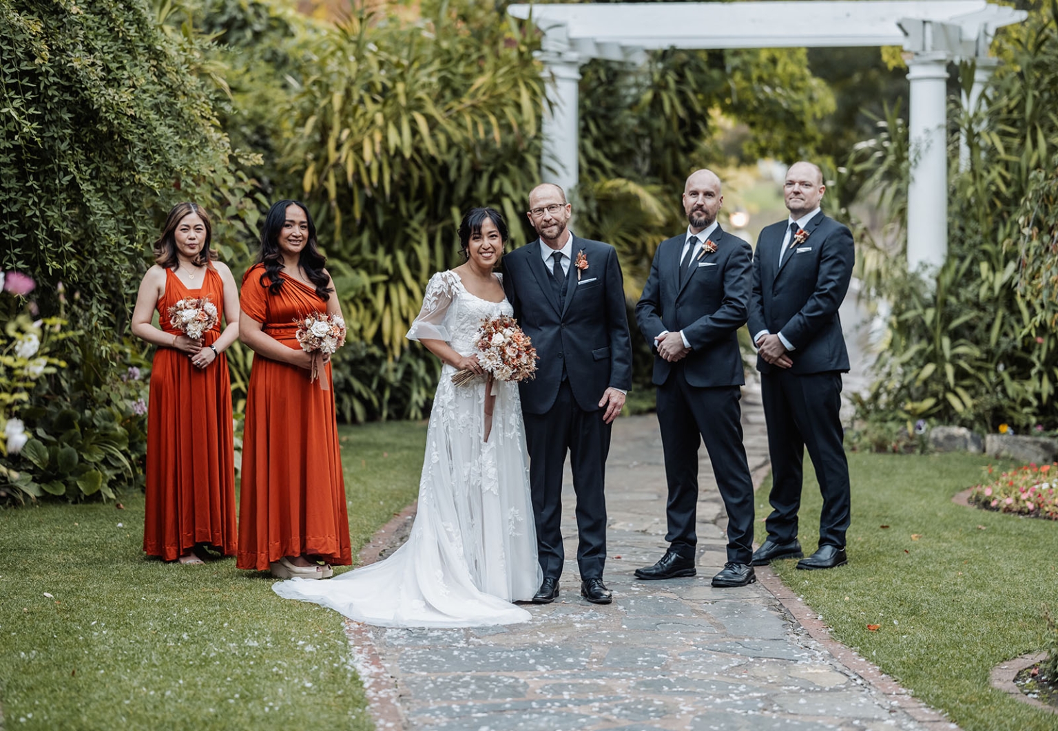 adelaide hills wedding at the manor - jo & dan 40 Elegant garden wedding party portrait with bride, groom, bridesmaids, and groomsmen.