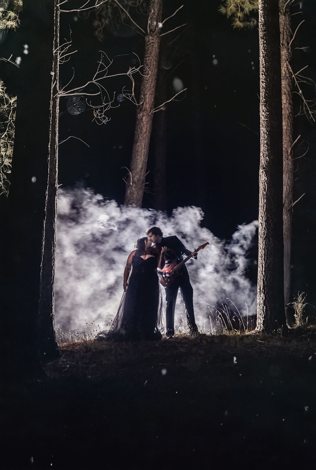 kuitpo forest metal themed wedding – erin & michael 41 Gothic couple kissing in dark forest with electric guitar and glowing smoke.