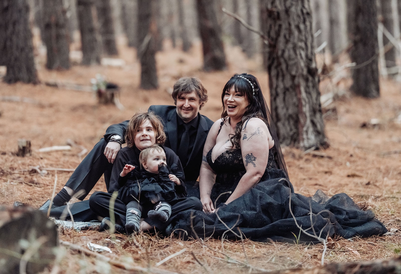 kuitpo forest metal themed wedding – erin & michael 17 Gothic family portrait in a forest with parents and children.