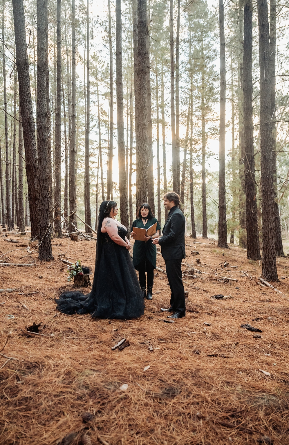 kuitpo forest metal themed wedding – erin & michael 13 Gothic forest wedding ceremony with bride in black gown, groom, and officiant.