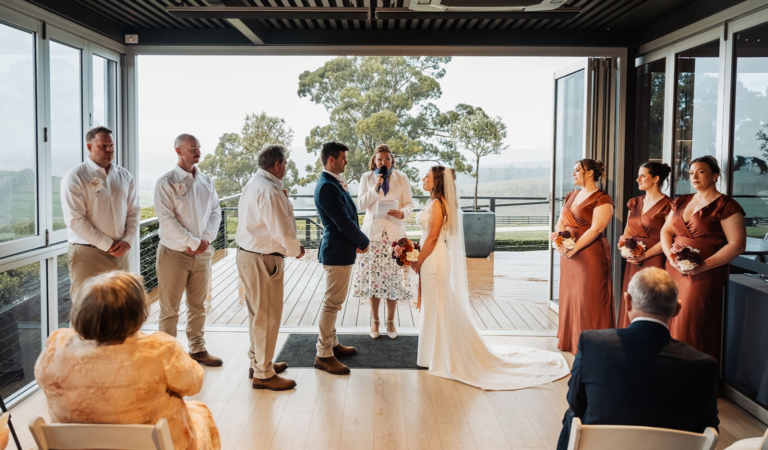 the lane vineyard wedding - caitlyn & craig 119 Elegant wedding ceremony with couple, bridesmaids, groomsmen, rustic flowers, and scenic backdrop.